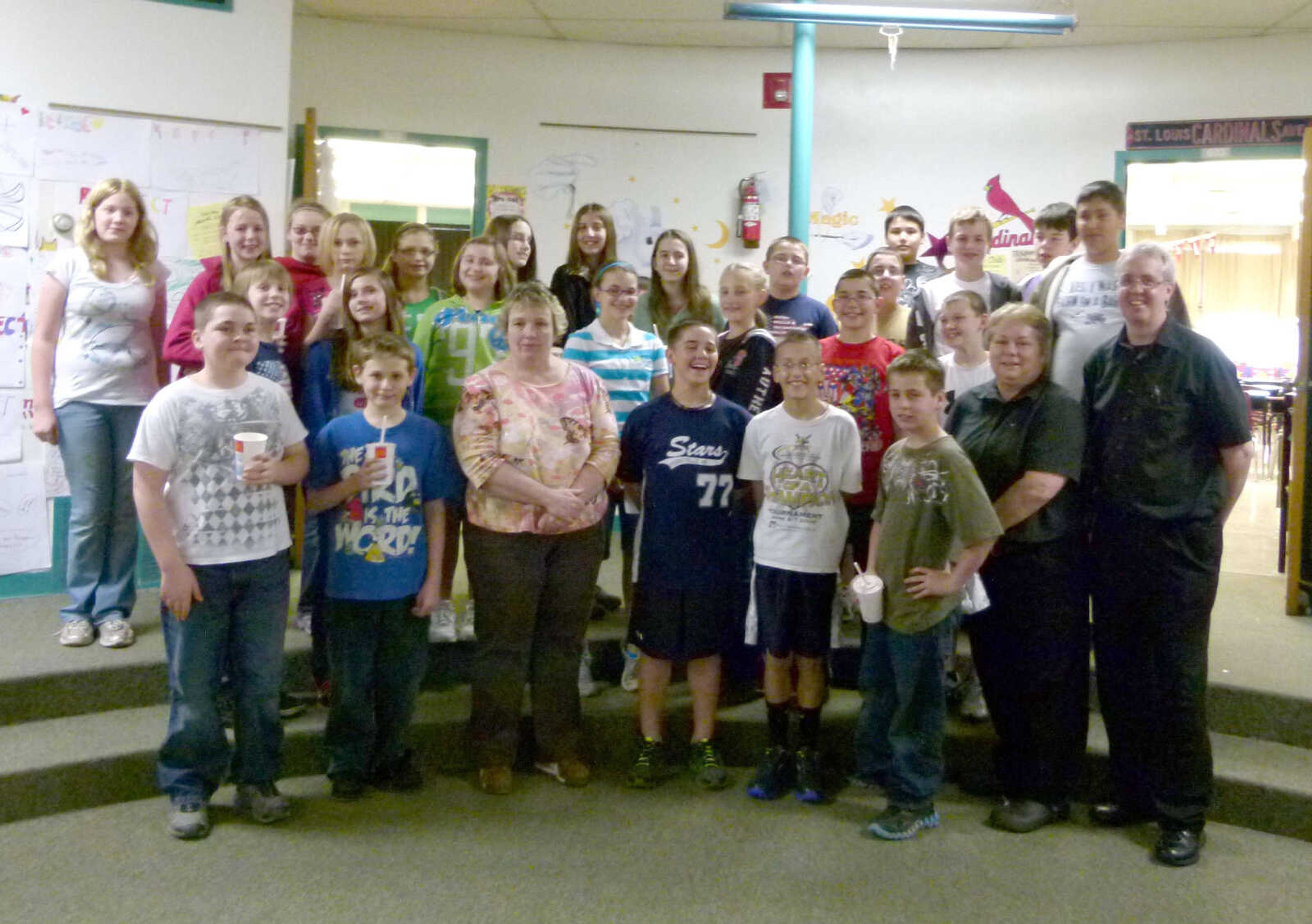 Mary Richardson’s class tied for first place in the PCMS sixth grade competition to collect soda pop tabs to benefit Ronald McDonald House. The students are pictured with Darlene Hudson and Don Webb of Perryville McDonald’s, who delivered lunch in appreciation for their support.