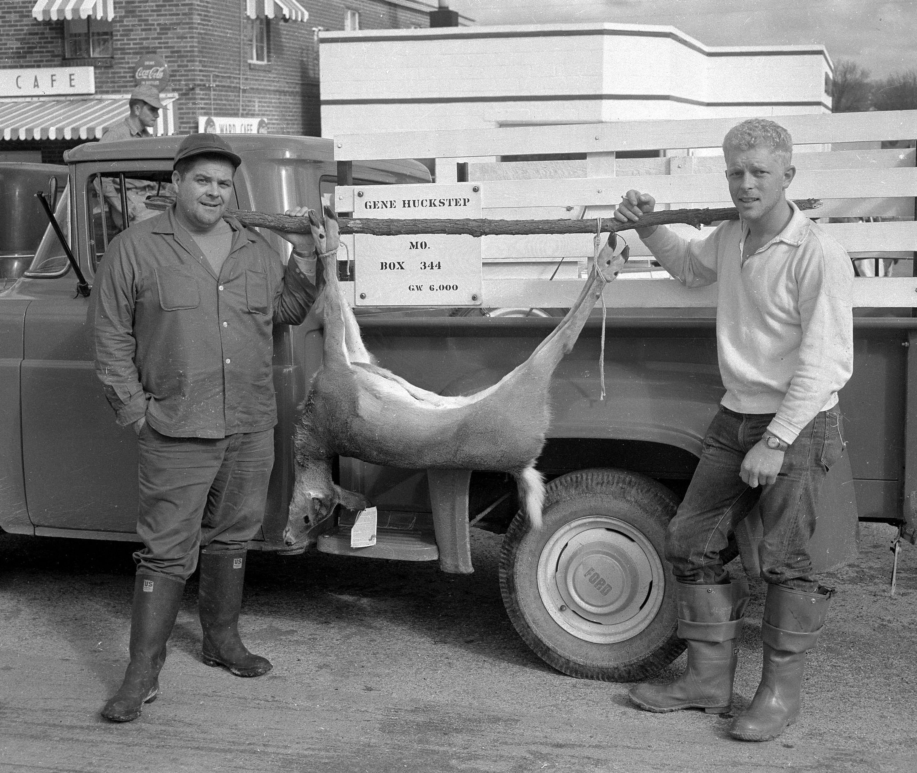 Robyn Vesterby bagged this doe in November 1958 near Marble Hill in Bollinger County. The deer, weighing less than 100 pounds, was deemed the ideal kill, yielding good venison steaks. At left is Gene Huckstep of Lutesville.
