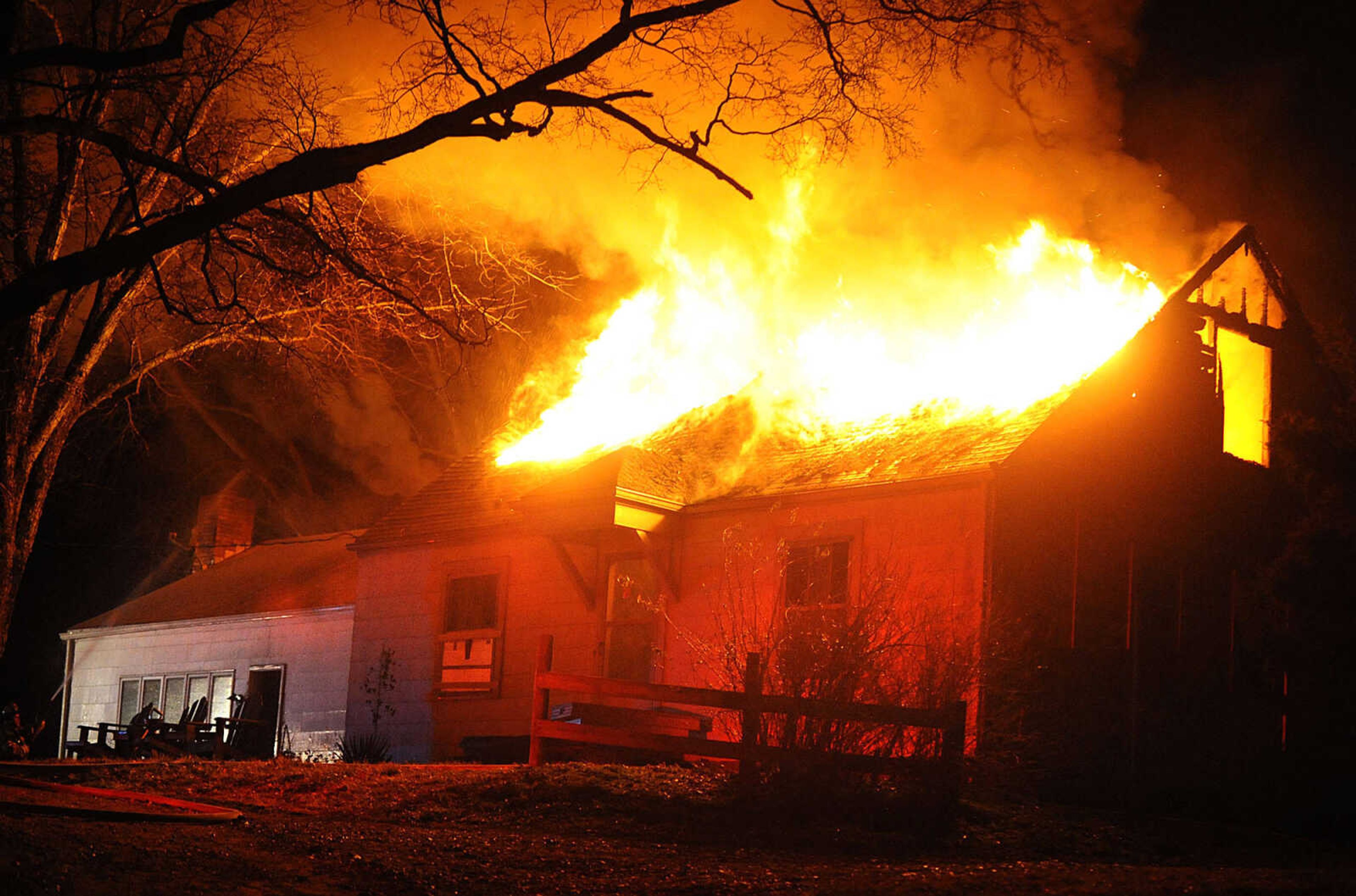 LAURA SIMON ~ lsimon@semissourian.com
Firefighters from Delta, Gordonville, Cape Girardeau, Millersville, Fruitland and East County Fire Departments battle a structure fire Wednesday night, January 9, 2012 on Onyx Lane in Cape Girardeau.