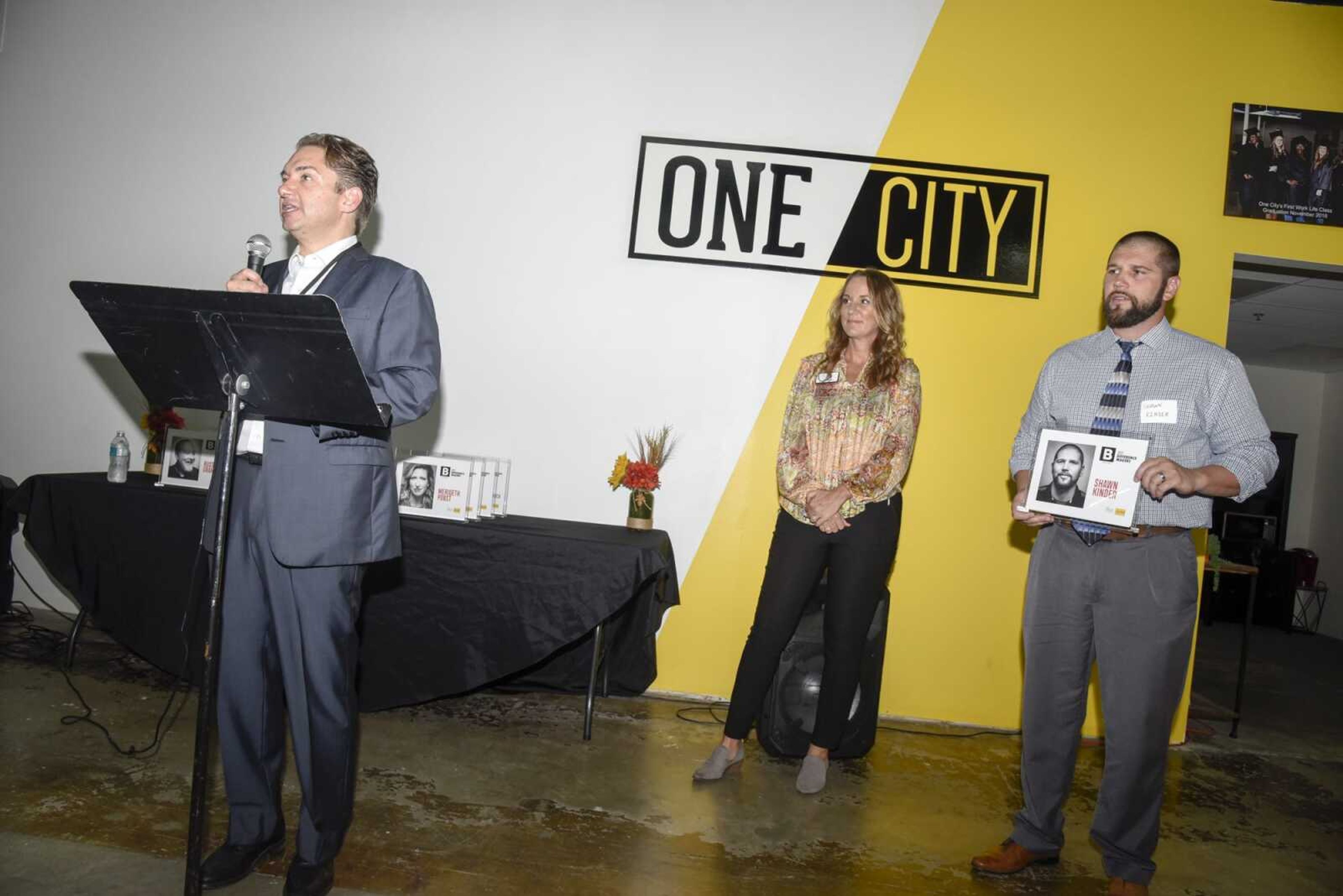 Jon K. Rust, publisher of the Southeast Missourian and co-president of Rust Communications, left, speaks about Shawn Kinder, right, as he is recognized Thursday during the B Magazine Difference Makers Reception at One City in Cape Girardeau. More photos of the 2021 B Magazine Difference Makers Reception can be seen in a gallery at semissourian.com.