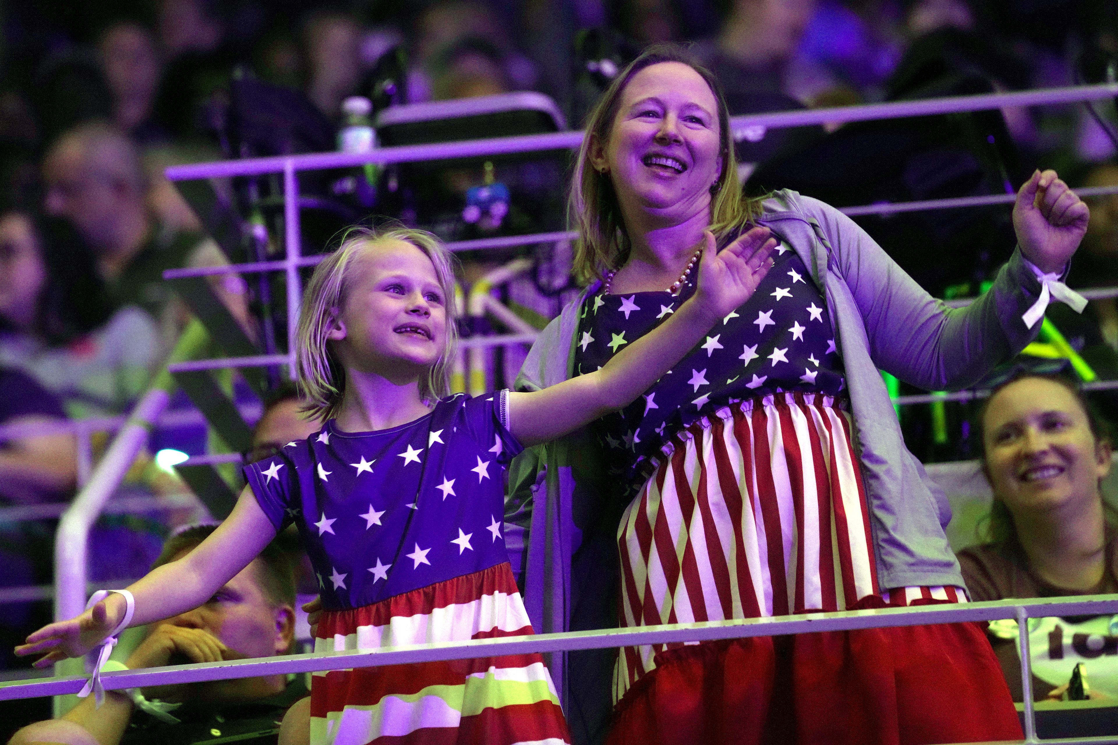 Attendees dance before Democratic presidential nominee Vice President Kamala Harris arrives to speak at a campaign rally at East Carolina University in Greenville, N.C., Sunday, Oct. 13, 2024. (AP Photo/Susan Walsh)