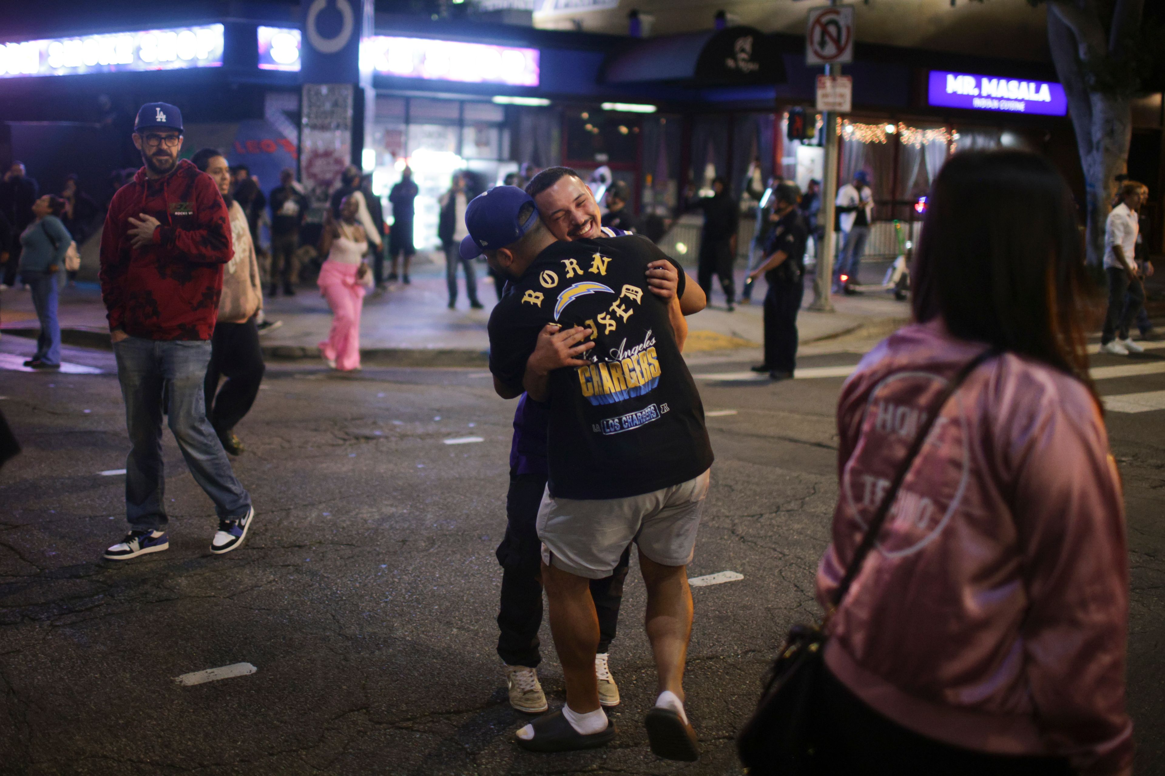 Fans celebrate on the streets after the Los Angeles Dodgers defeated the New York Yankees to win the baseball World Series Wednesday, Oct. 30, 2024, in Los Angeles. (AP Photo/Ethan Swope)