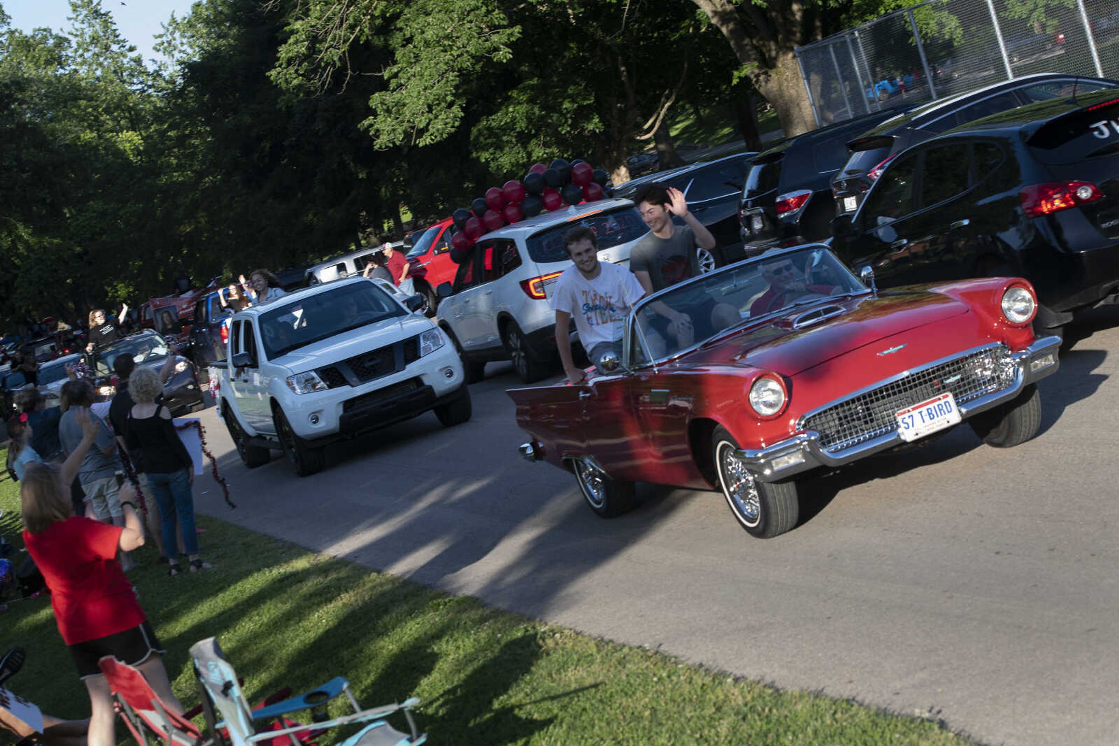 People take part in a parade for Jackson High School seniors Friday, May 29, 2020, at Jackson City Park.