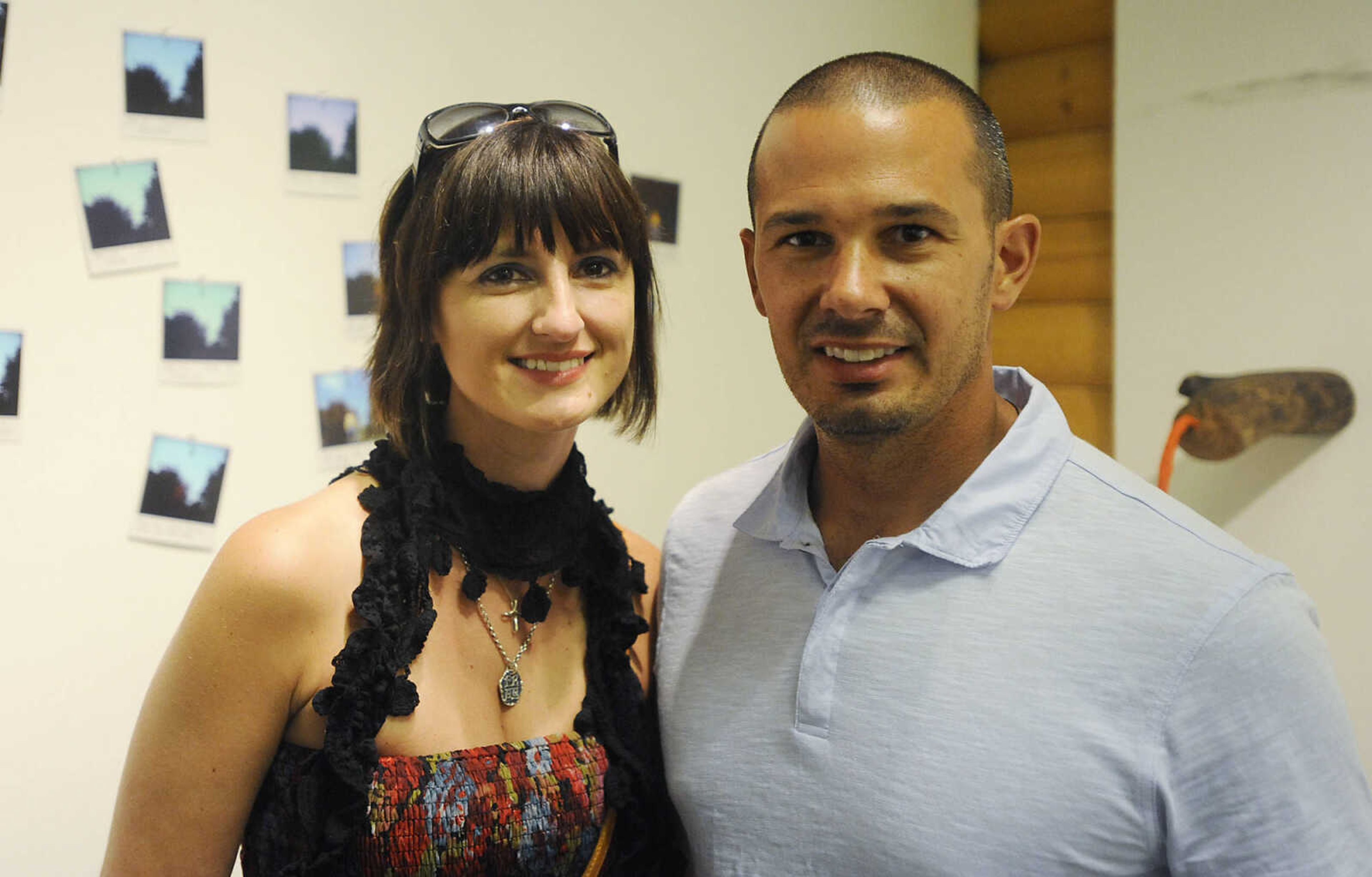 Danea, left, and Michael Johnson Friday, July 6, at the Cape Arts Council, 32 N. Main Street, during First Friday. The first Friday of each month galleries in Downtown Cape Girardeau hold openings from 5 p.m to 9 p.m. with food, drink and the opportunity to talk with the artists about their work.