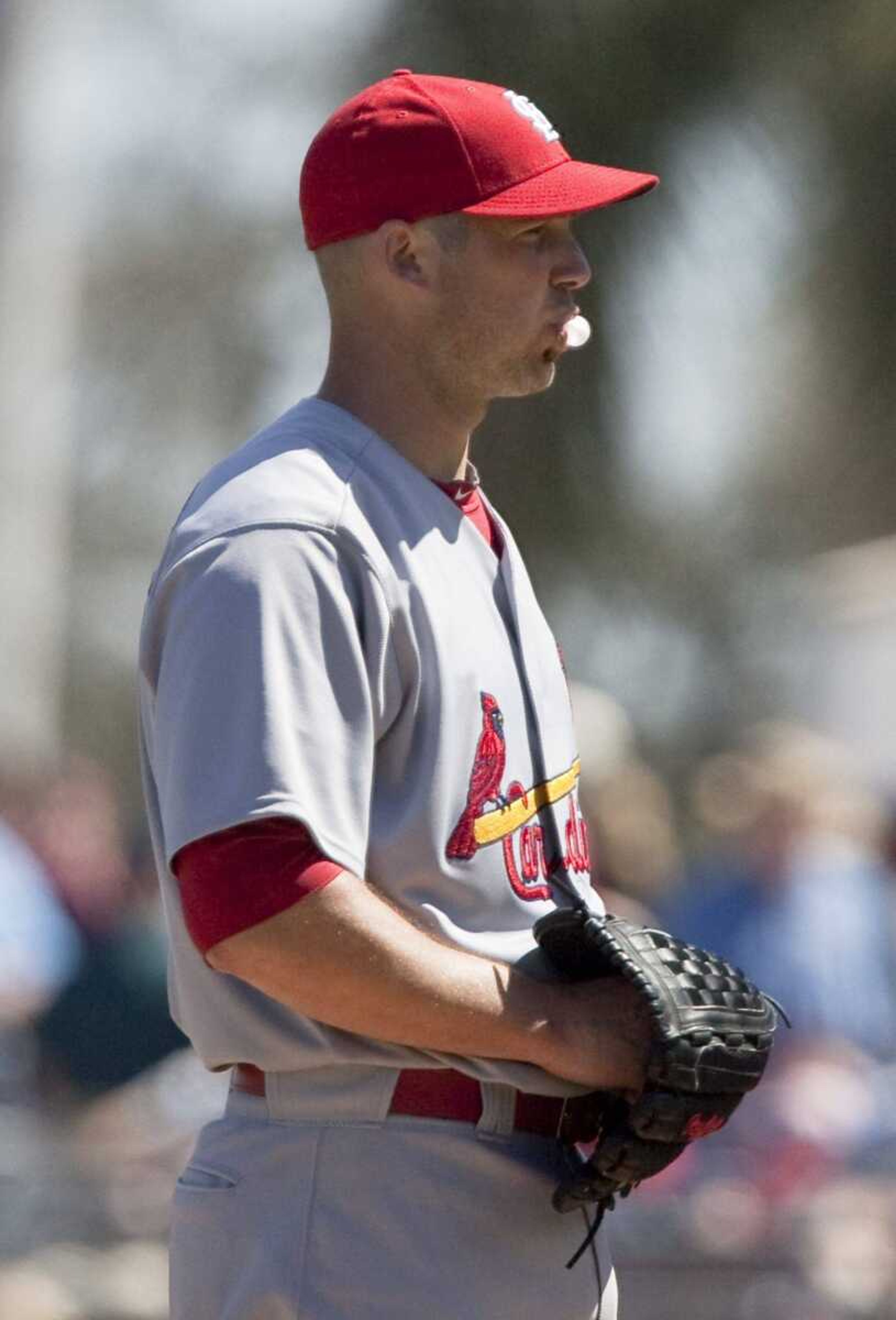 Cardinals pitcher Chris Carpenter blows a bubble while working against the Red Sox during Monday's spring training game in Fort Myers, Fla. Carpenter made his first start of the spring. (Nati Harnik ~ Associated Press)