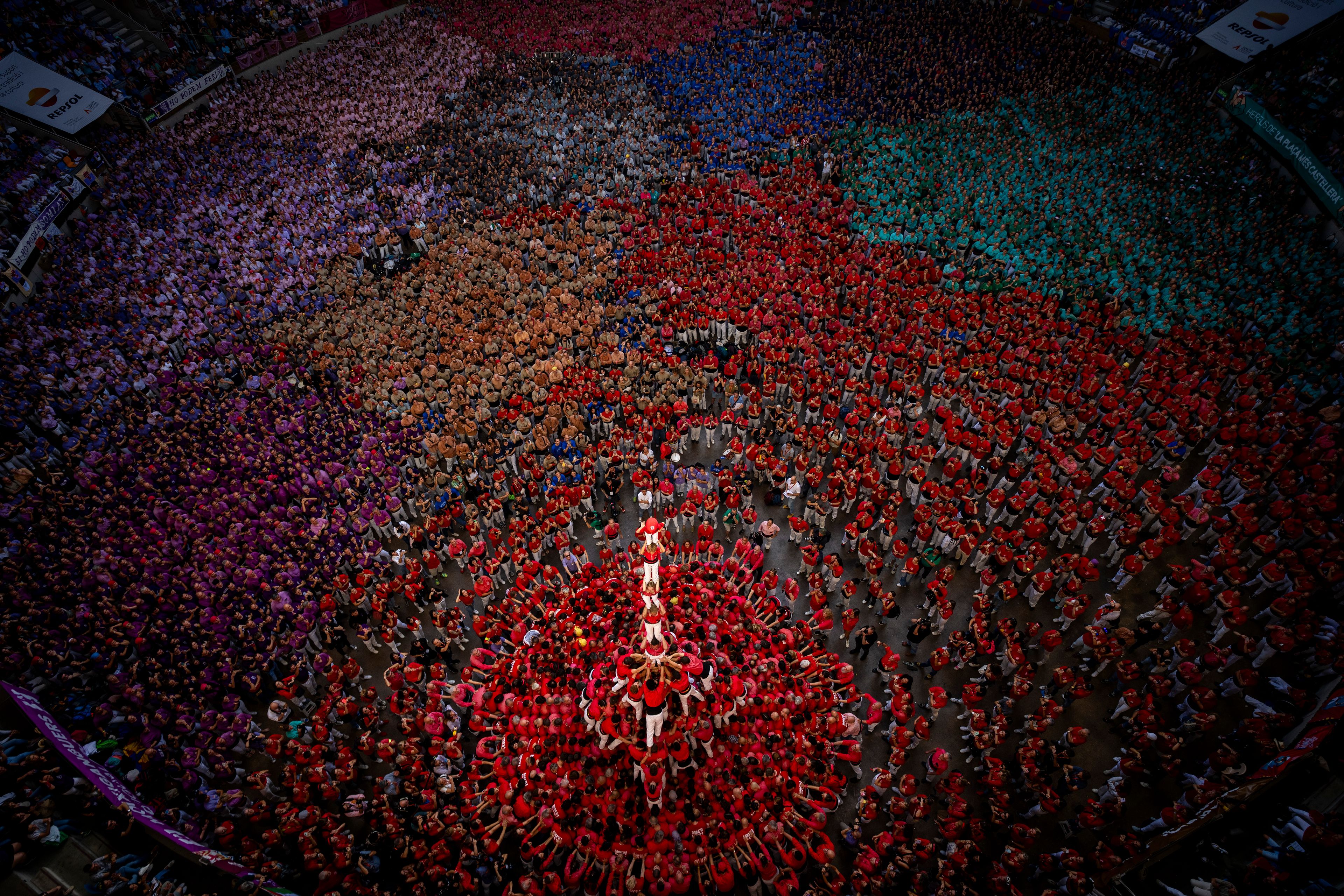 Members of "Colla Joves Xiquets de Valls" form a "Castell" or human tower, during the 29th Human Tower Competition in Tarragona, Spain, Sunday, Oct. 6, 2024. (AP Photo/Emilio Morenatti)