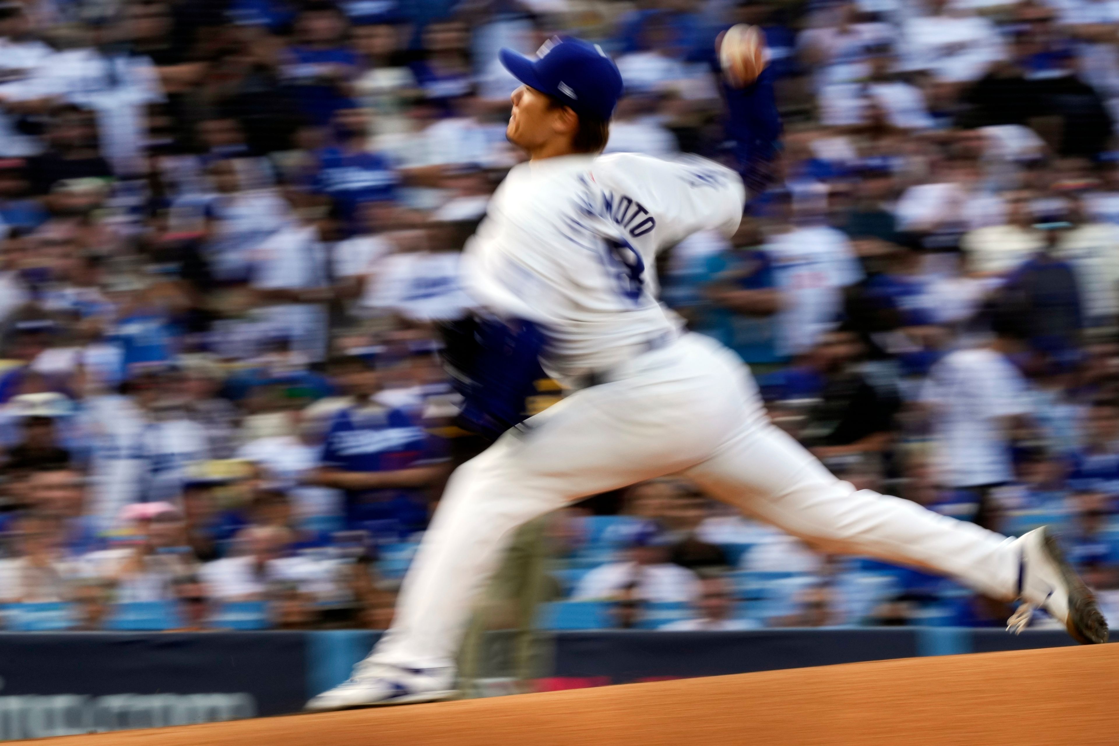 Los Angeles Dodgers starting pitcher Yoshinobu Yamamoto throws to a San Diego Padres batter during the first inning in Game 5 of a baseball NL Division Series Friday, Oct. 11, 2024, in Los Angeles. (AP Photo/Mark J. Terrill)