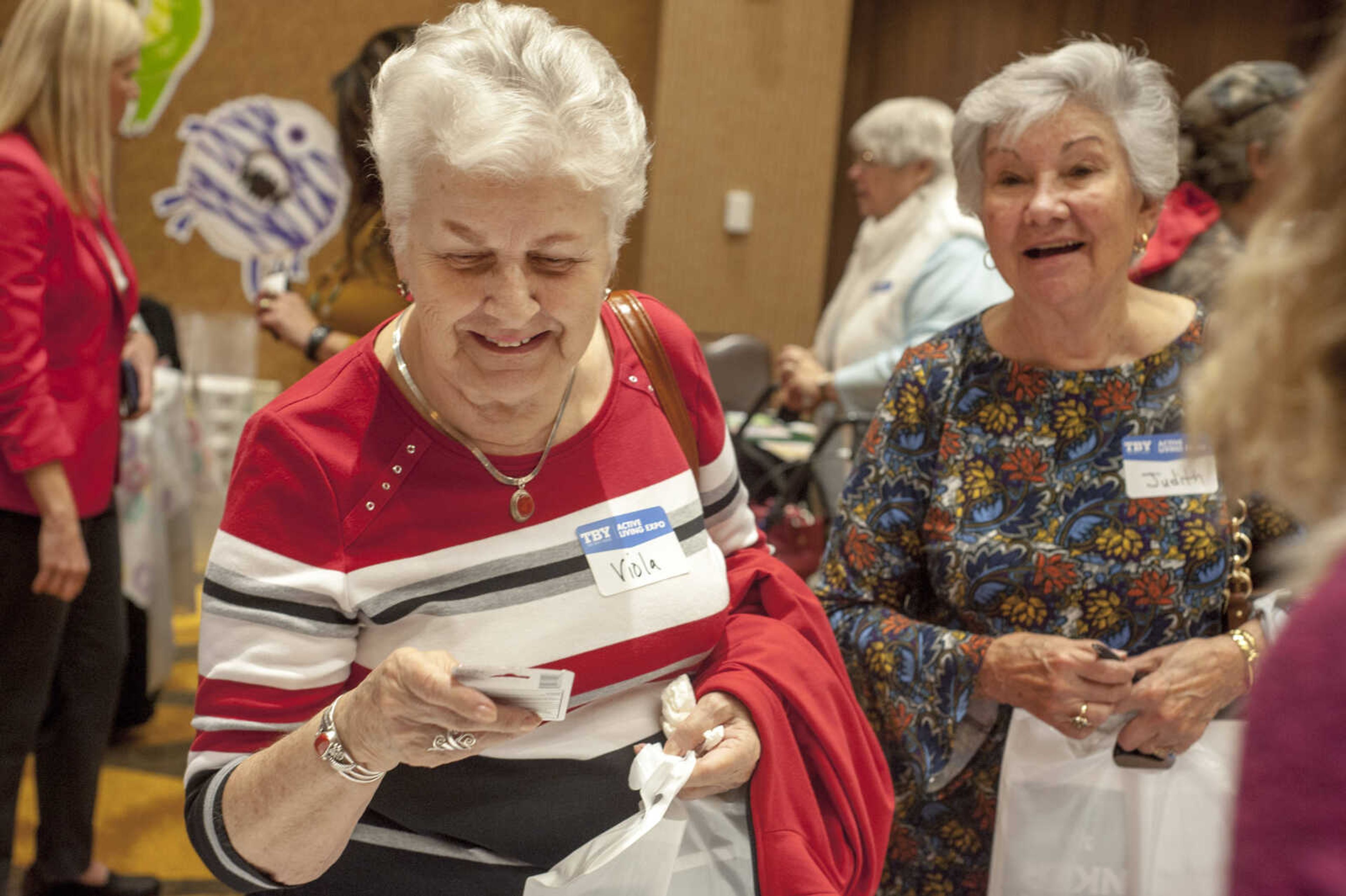 Viola Amschler, left, browses at a booth with her friend Judith Hopfer, right, during the TBY Active Living Expo Wednesday, Oct. 9, 2019, at the Isle Casino in Cape Girardeau.