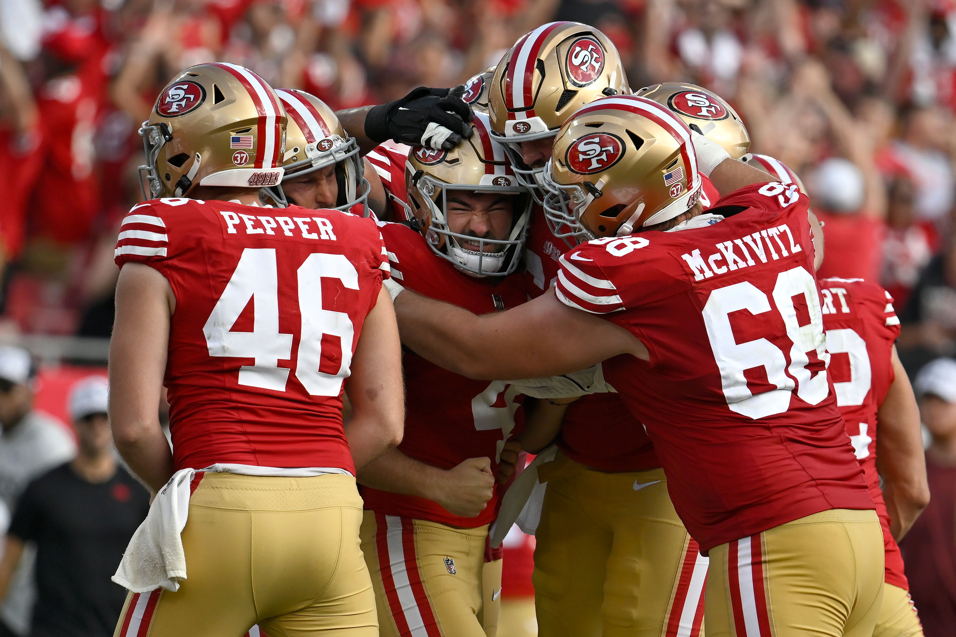 San Francisco 49ers place kicker Jake Moody, middle, celebrates with teammates after kicking the game winning field goal during the second half of an NFL football game against the Tampa Bay Buccaneers in Tampa, Fla., Sunday, Nov. 10, 2024. (AP Photo/Jason Behnken)