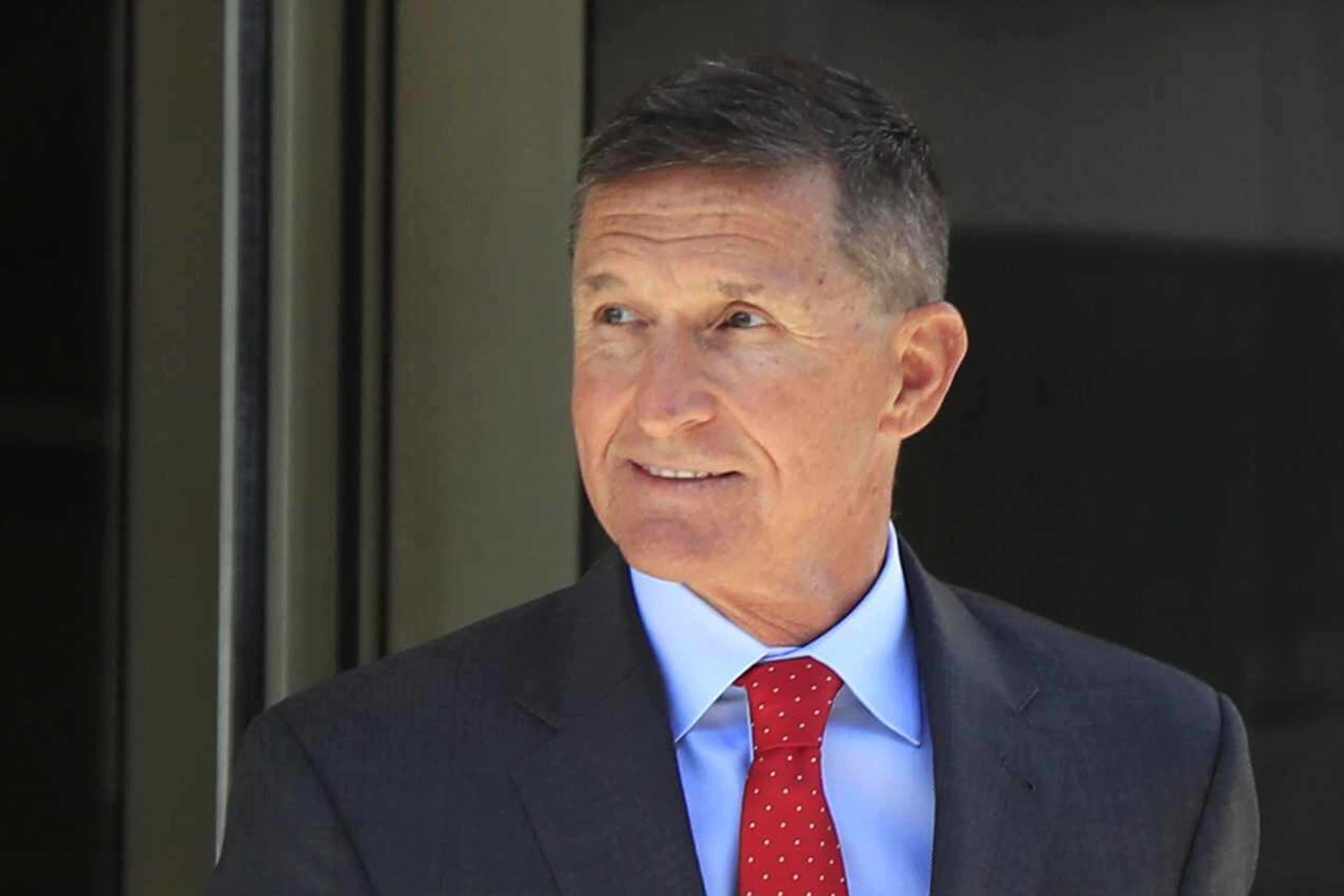 Former Trump national security adviser Michael Flynn leaves the federal courthouse in Washington, following a 2018 status hearing.