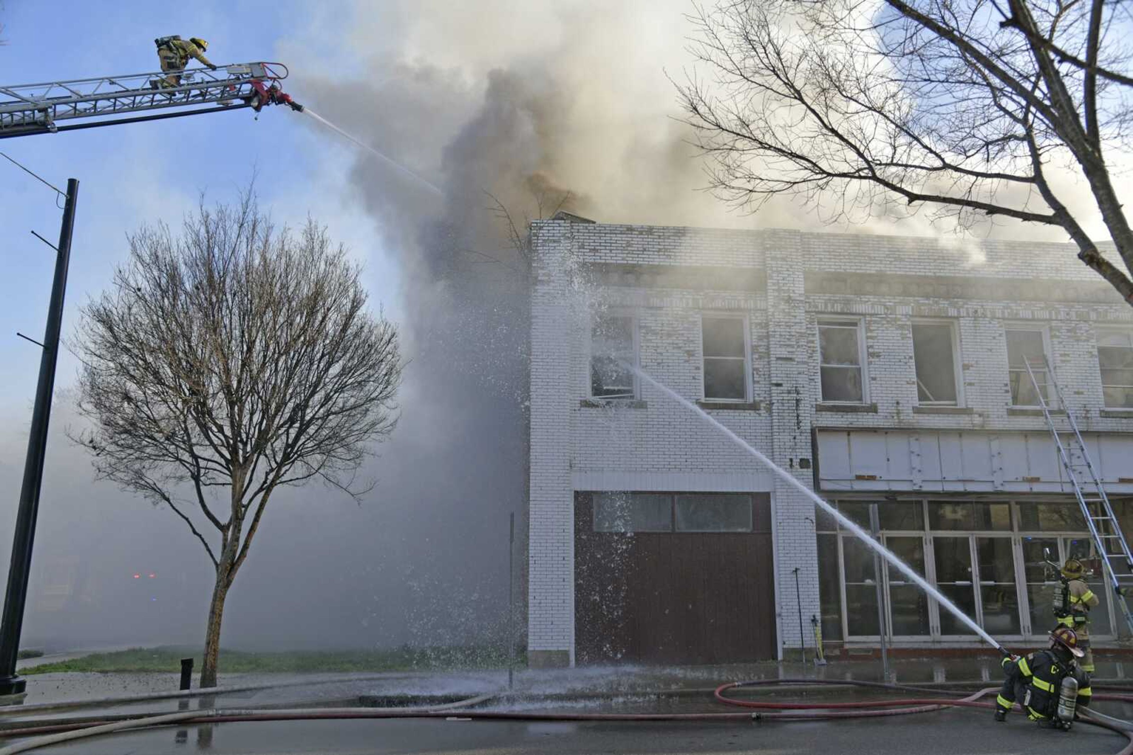 Cape Girardeau firefighters use hoses to put out a March 31 fire in the former Broadway Theatre building in downtown Cape Girardeau.