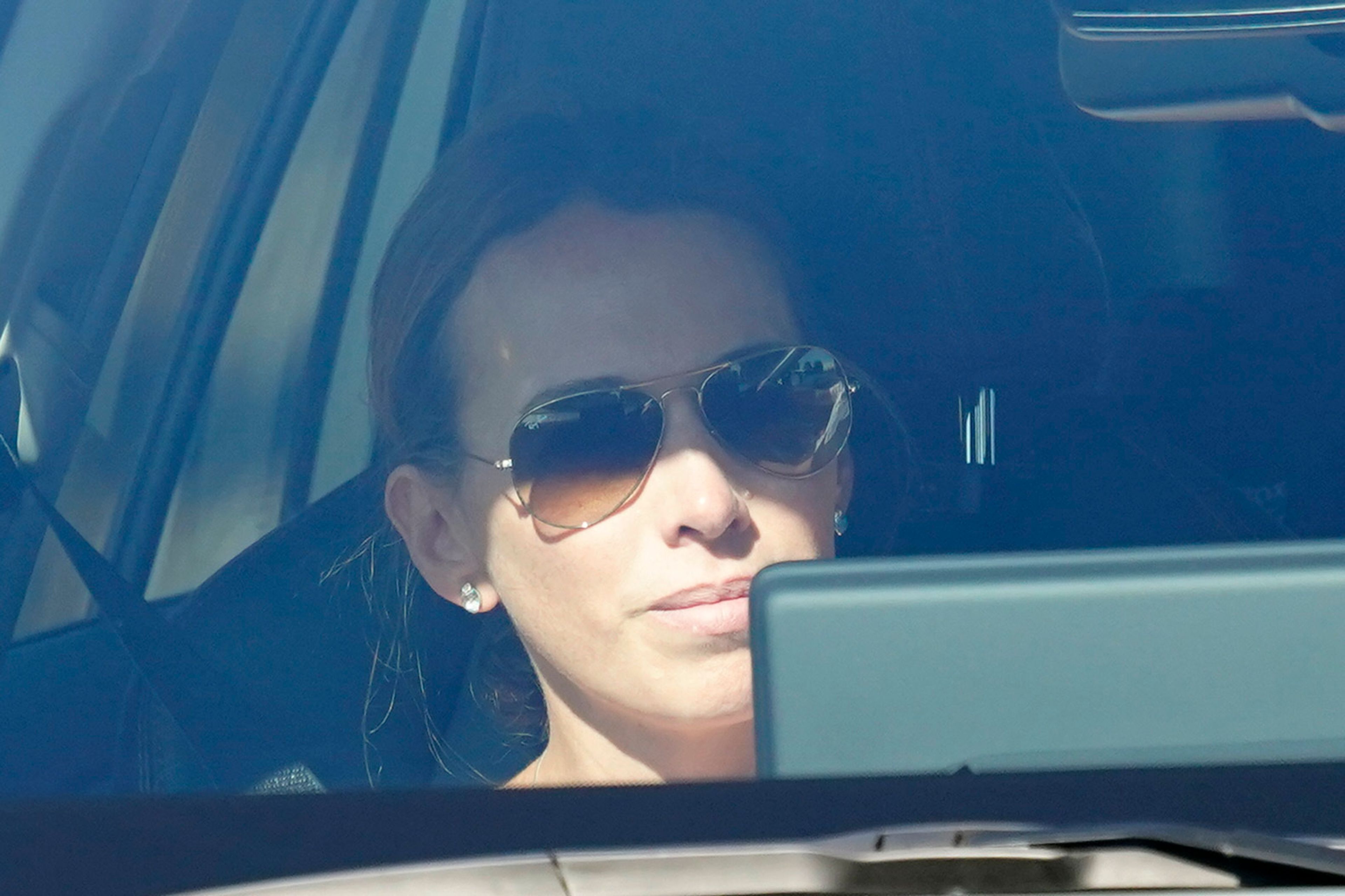 Carolina, the daughter of Edmundo González, is photographed traveling inside a car as she leaves the Torrejón Air Base in Madrid, Spain, Sunday, Sept. 8, 2024. Former Venezuelan opposition presidential candidate Edmundo González has fled into exile after being granted asylum in Spain, delivering a major blow to millions who placed their hopes in his upstart campaign to end two decades of single-party rule. (AP Photo/Andrea Comas)