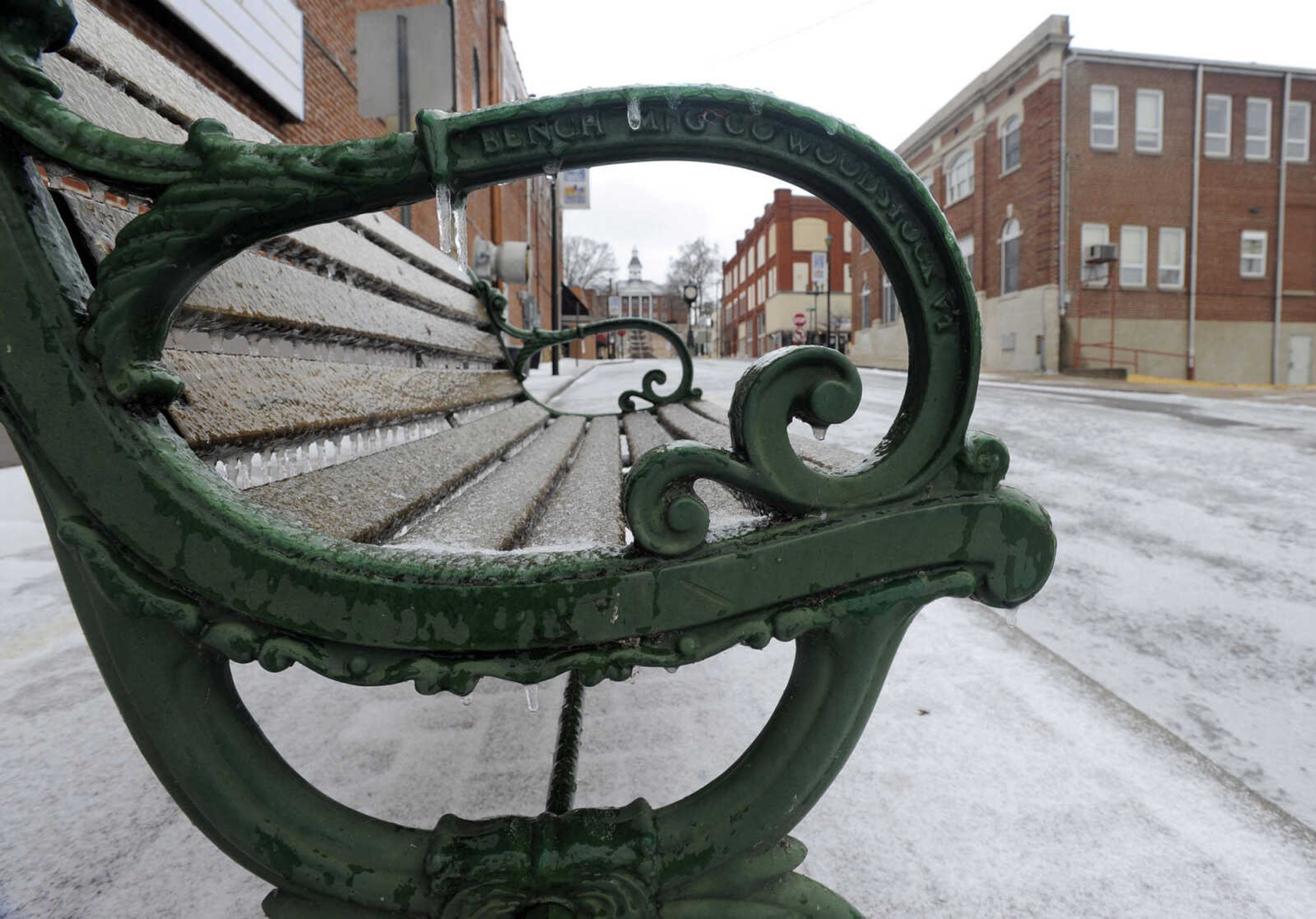 FRED LYNCH ~ flynch@semissourian.com
A coating of ice covers a bench, the sidewalk and most of Themis Street near Water Street on Sunday, March 2, 2014 in downtown Cape Girardeau.