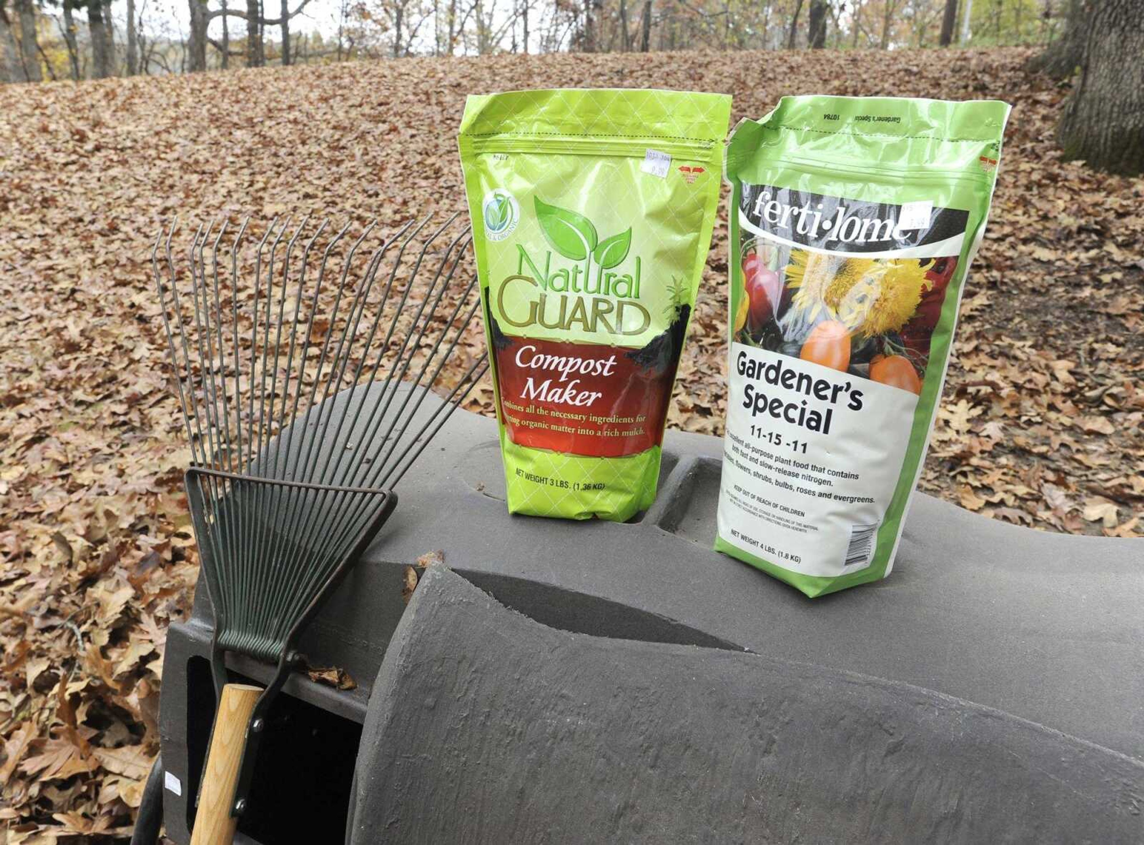 Two garden products, compost maker and fertilizer, are shown with a tumbling composter. (Fred Lynch)