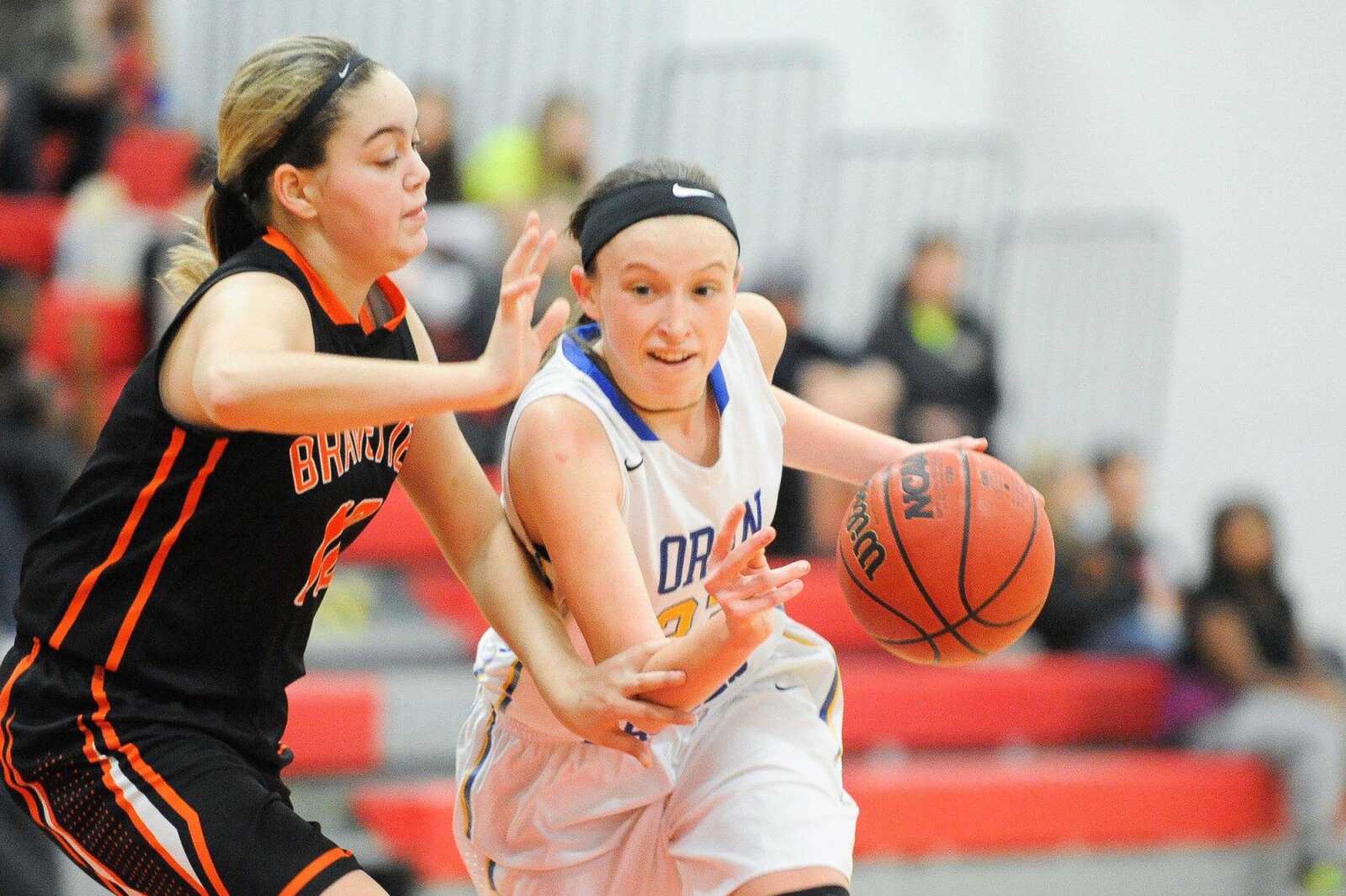 Oran's Leah Cauble drives past Scott County Central's Hailey Kesler during the second quarter of the championship game in the Scott-Mississippi Conference Tournament.