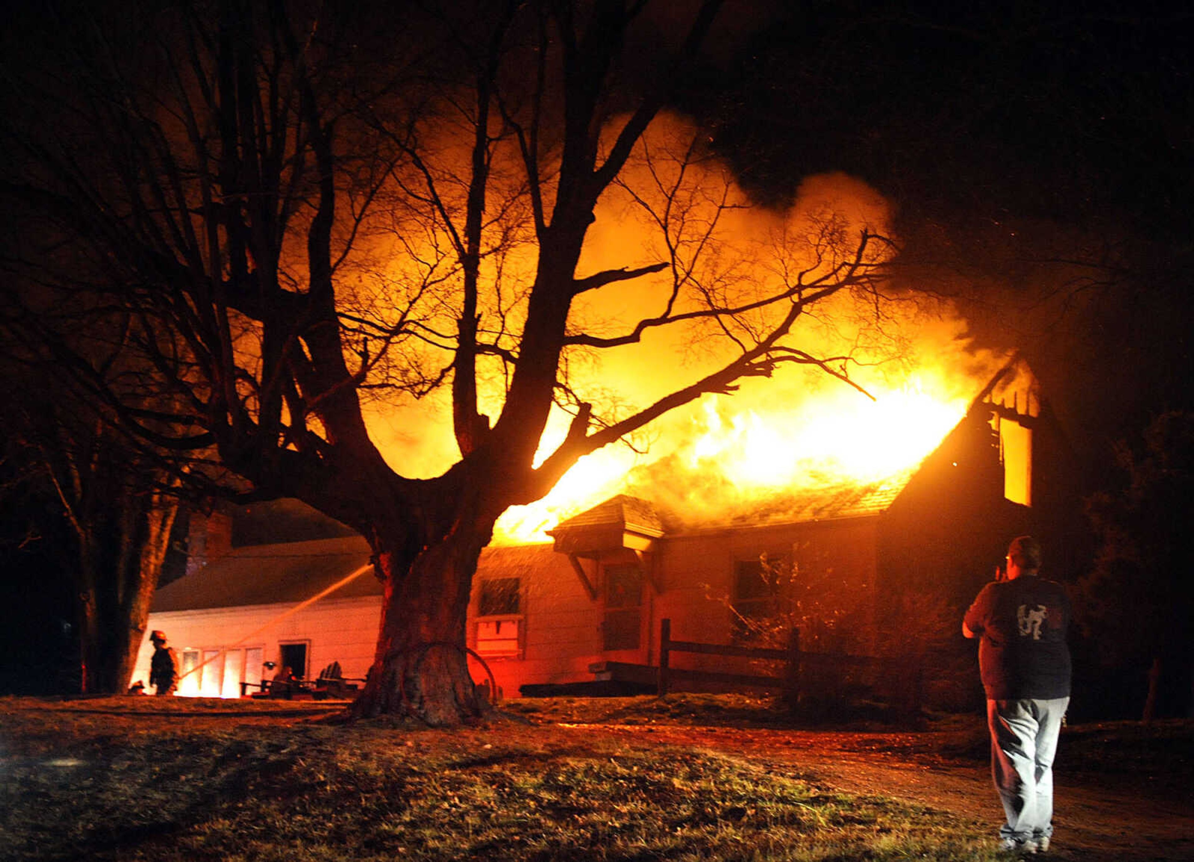 LAURA SIMON ~ lsimon@semissourian.com
Firefighters from Delta, Gordonville, Cape Girardeau, Millersville, Fruitland and East County Fire Departments battle a structure fire Wednesday night, January 9, 2012 on Onyx Lane in Cape Girardeau.