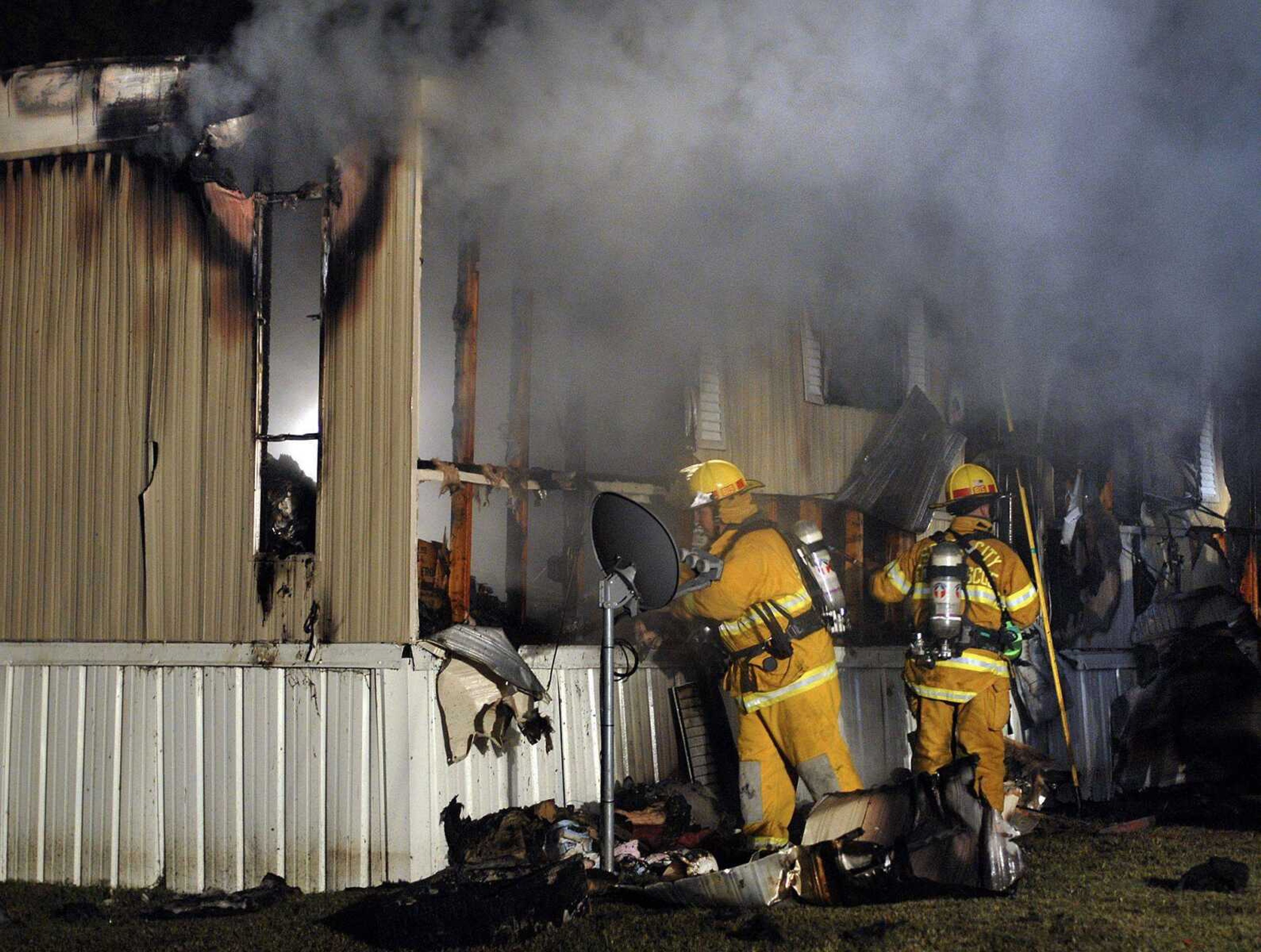 Scott City firefighters work a mobile home fire in the east section of town Saturday night. A man died in the blaze.

FRED LYNCH 
flynch@semissourian.com