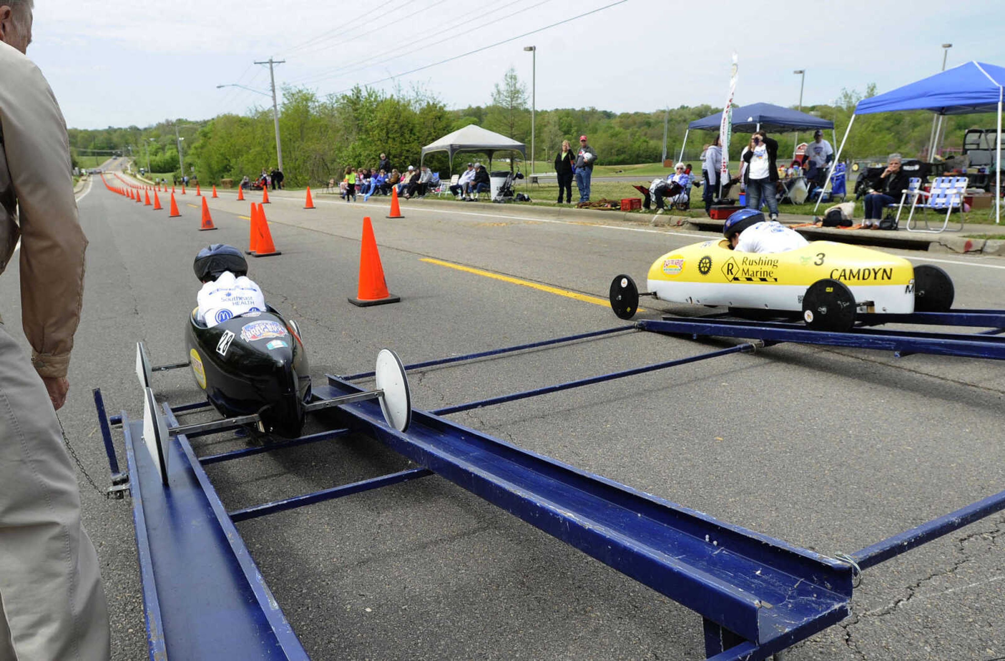 Milo Greenfeld, left, and Camdyn Shemonic begin their race during the Soap Box Derby sponsored by the Cape Girardeau Rotary Club on Saturday, May 3, 2014 in Cape Girardeau.