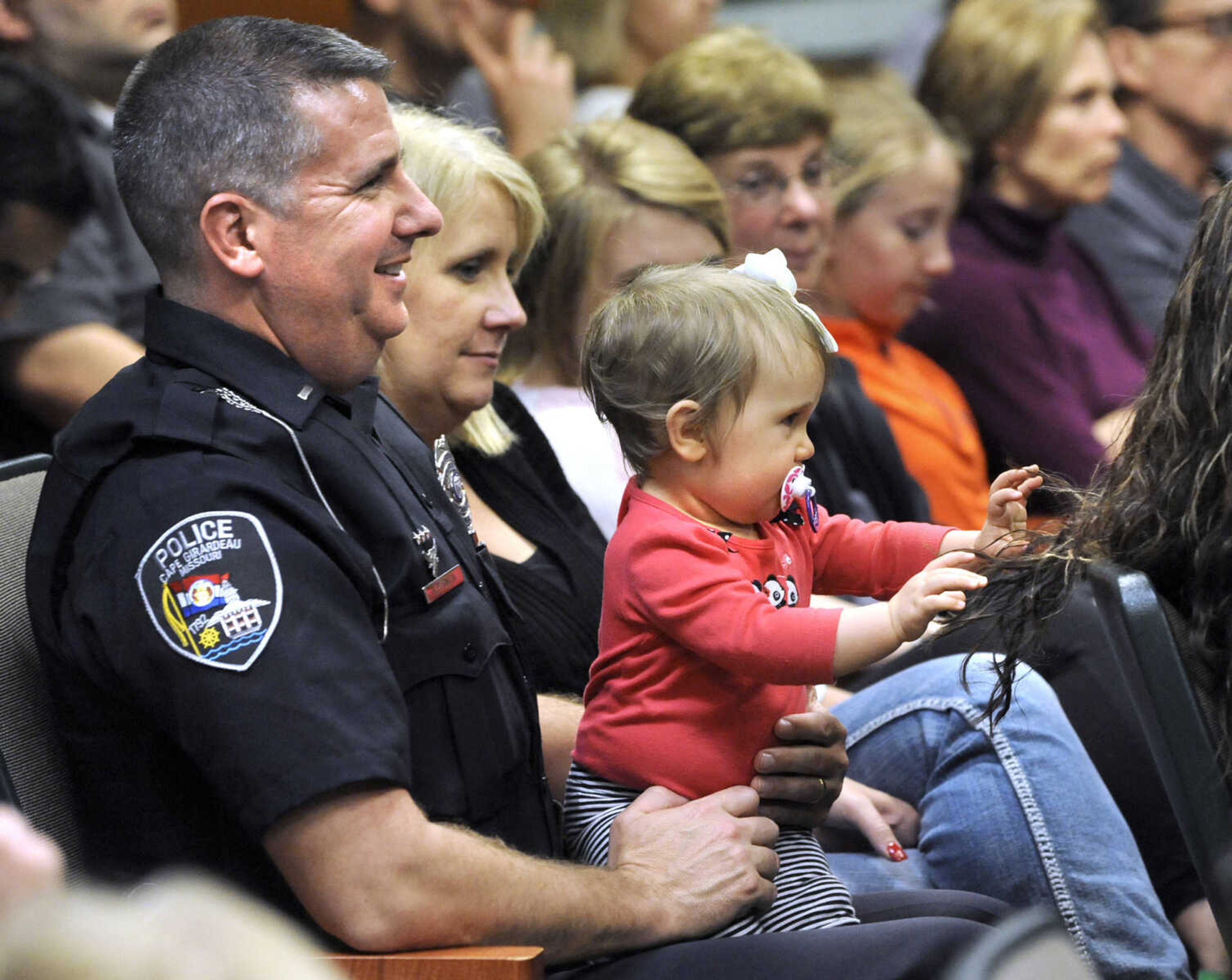 FRED LYNCH ~ flynch@semissourian.com
Bradley Smith and his wife, Debbie, with their daughter, Natalee, attend the Cape Girardeau Law Enforcement Appreciation Day program Tuesday, April 21, 2015 at the Conservation Nature Center in Cape County Park North.