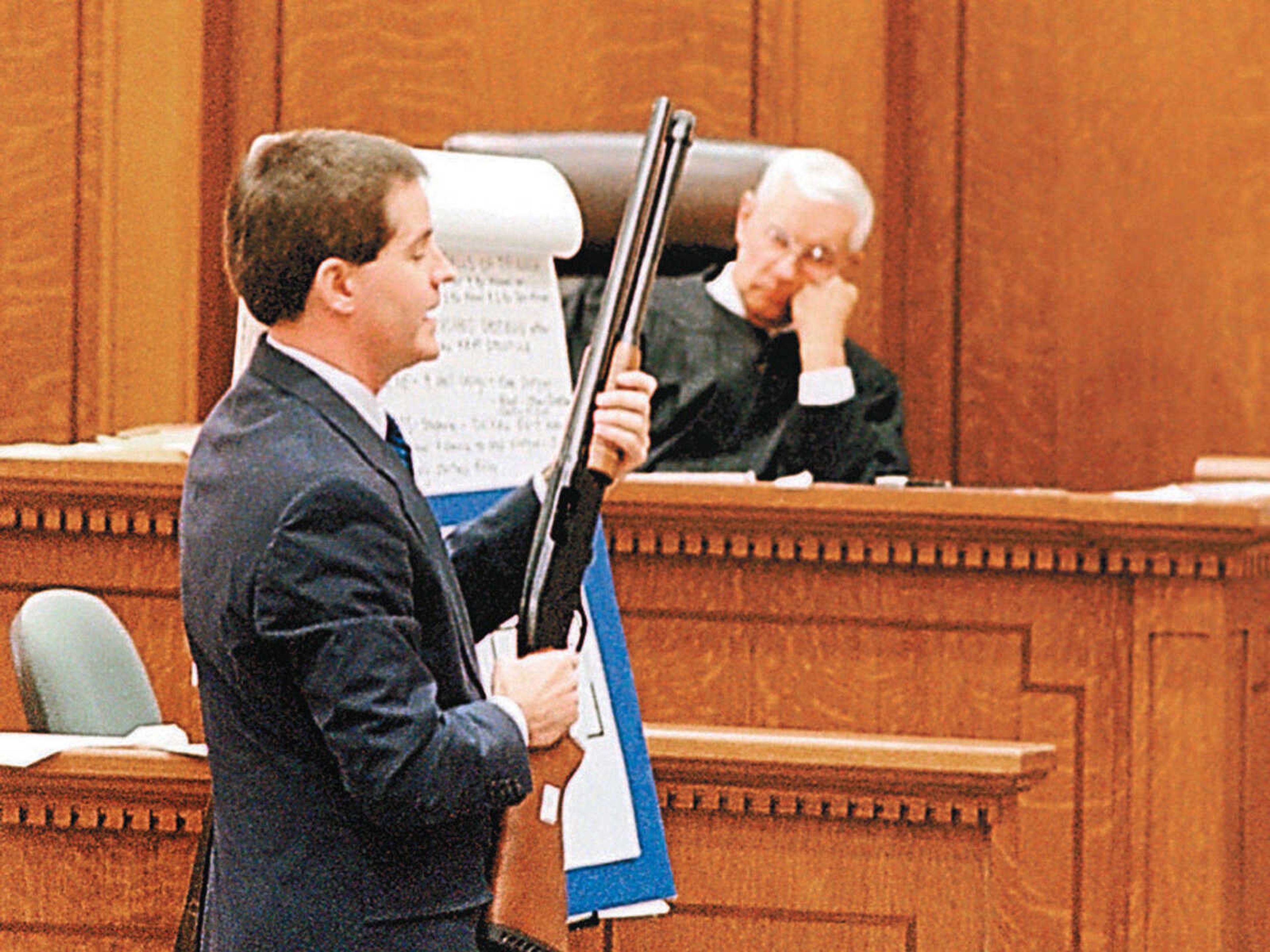 Cape Girardeau County Prosecuting Attorney Morley Swingle on April 3, 1997, displays to a jury the shotgun that was used by Michael L. Sanders, 27, to try to defend himself when Russell E. Bucklew, 28, shot and killed Sanders in Sanders' home March 21, 1996. (Don Shrubshell ~ Southeast Missourian file)