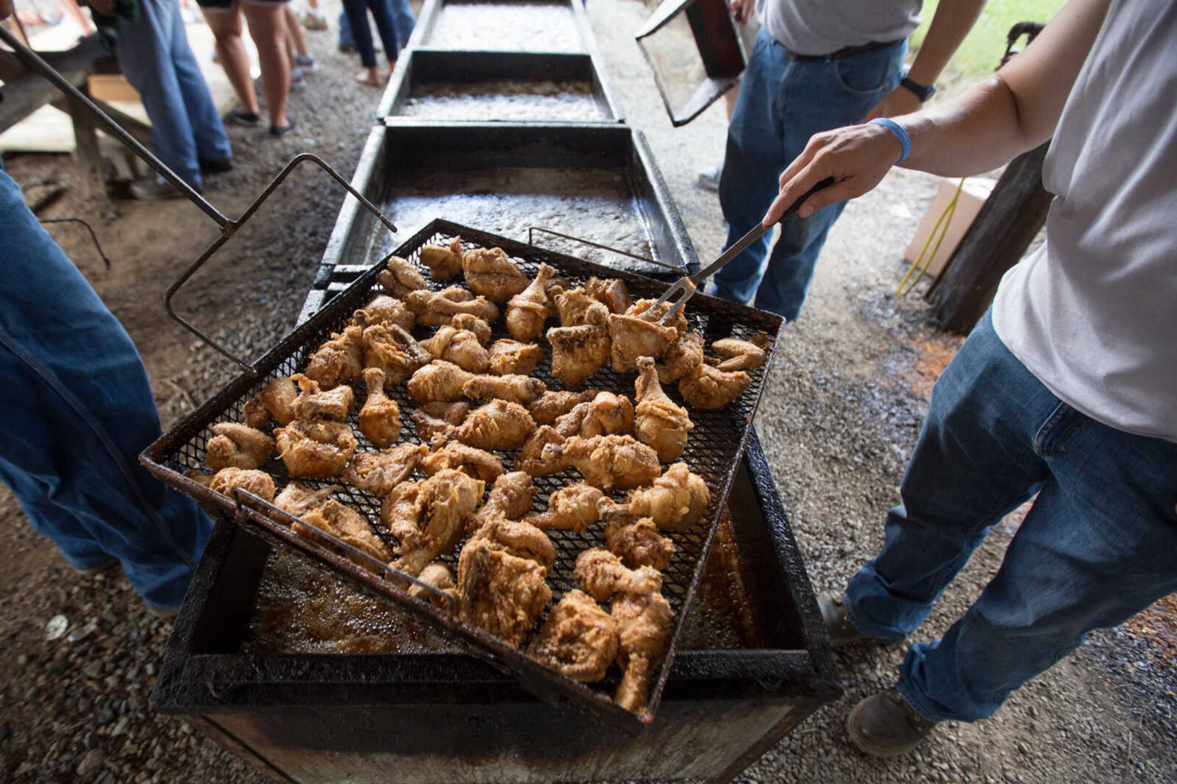 GLENN LANDBERG ~ glandberg@semissourian.com


Cooks check on fried chicken while preparing for the annual parish picnic on Saturday, July 30, 2016 at St. John's Catholic Church in Leopold, Mo.