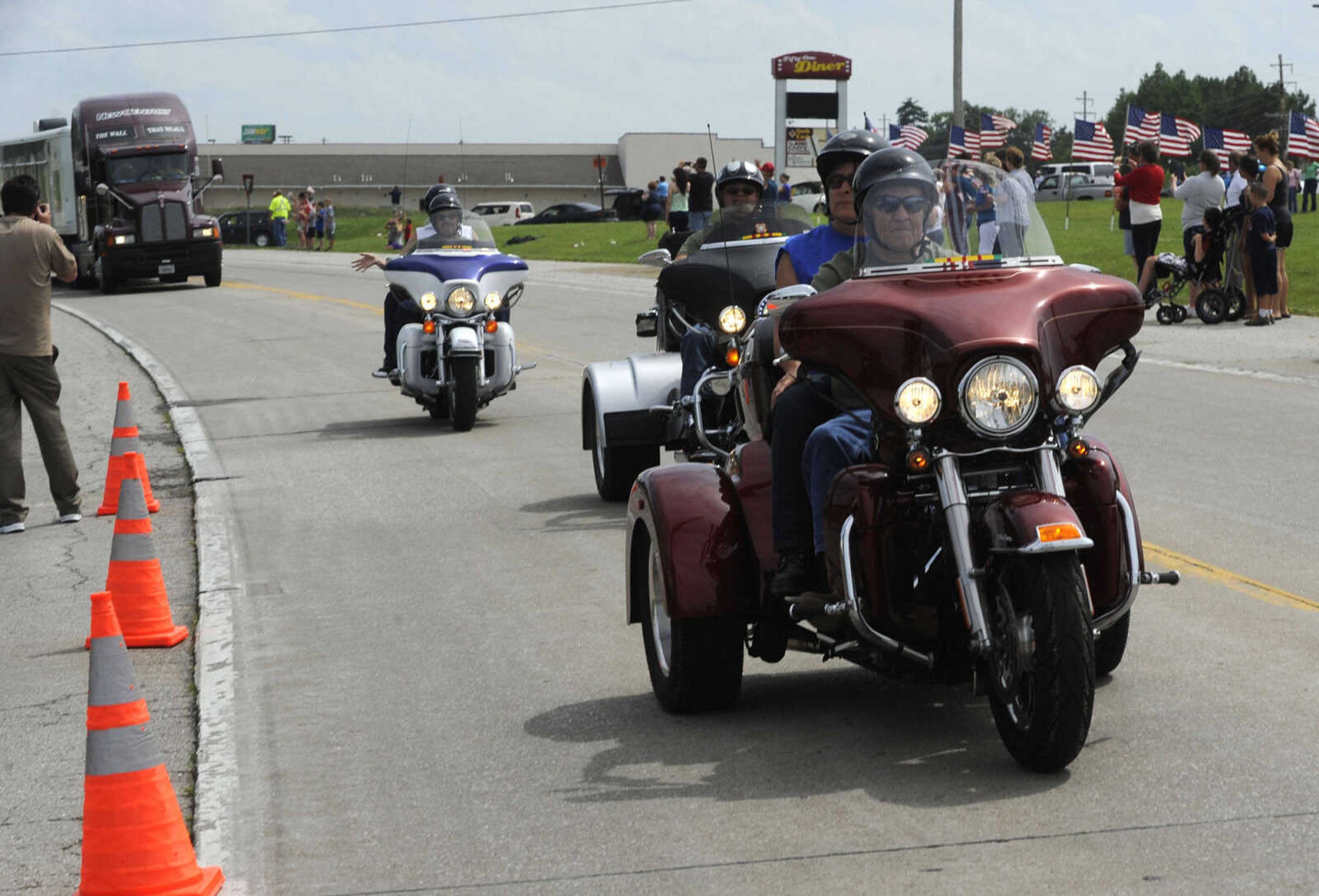 Motorcyclists escort The Wall That Heals on Tuesday, June 17, 2014 in Perryville, Mo.