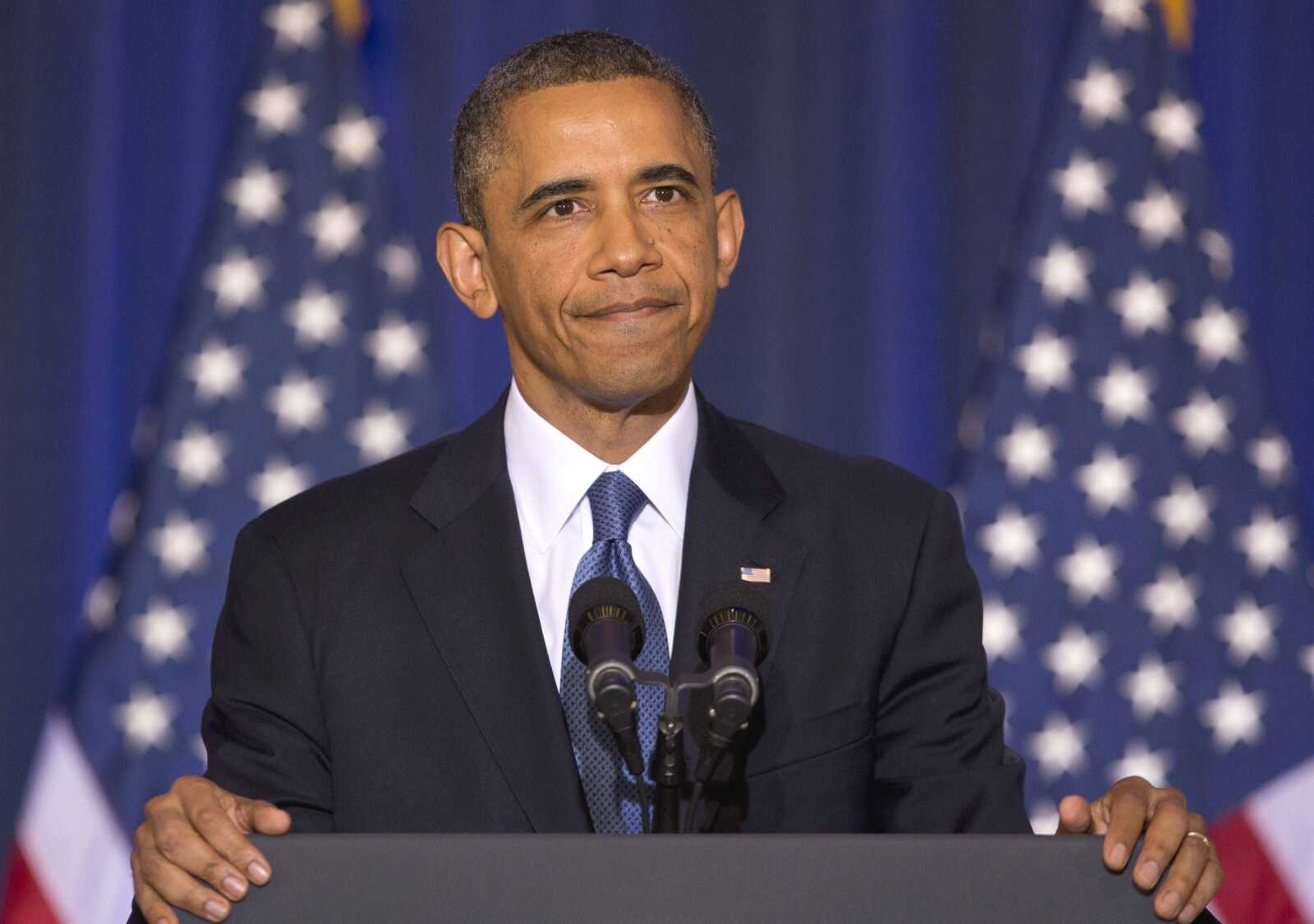 President Obama reacts to CODEPINK founder Medea Benjamin as she shouts at him from the back of the room during his national security speech Thursday at the National Defense University at Fort McNair in Washington. (Carolyn Kaster ~ Associated Press)