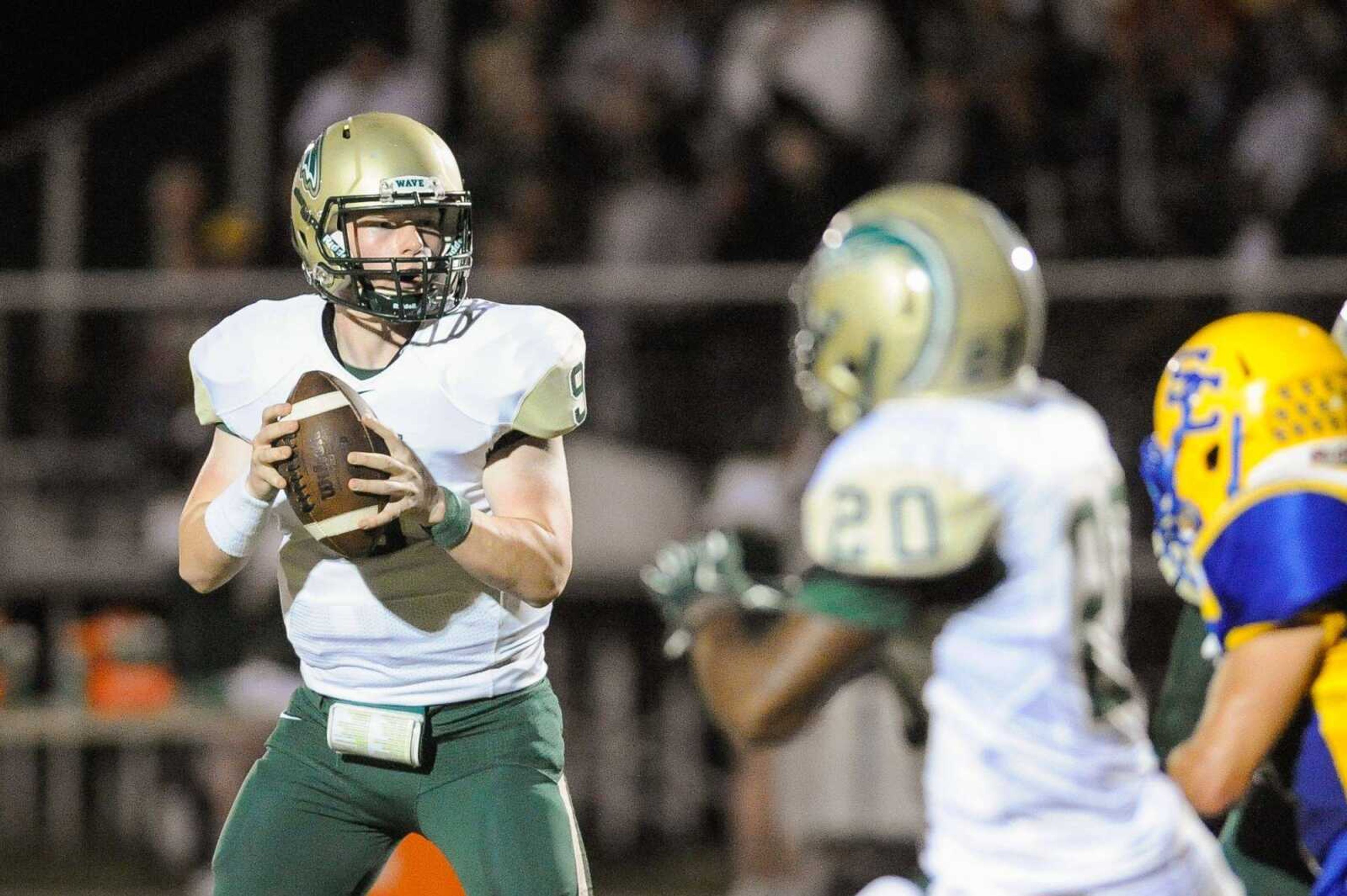 Malden's Chapen Riley looks for an open receiver in the second quarter against Scott City Friday, Sept. 11, 2015 in Scott City. (Glenn Landberg)