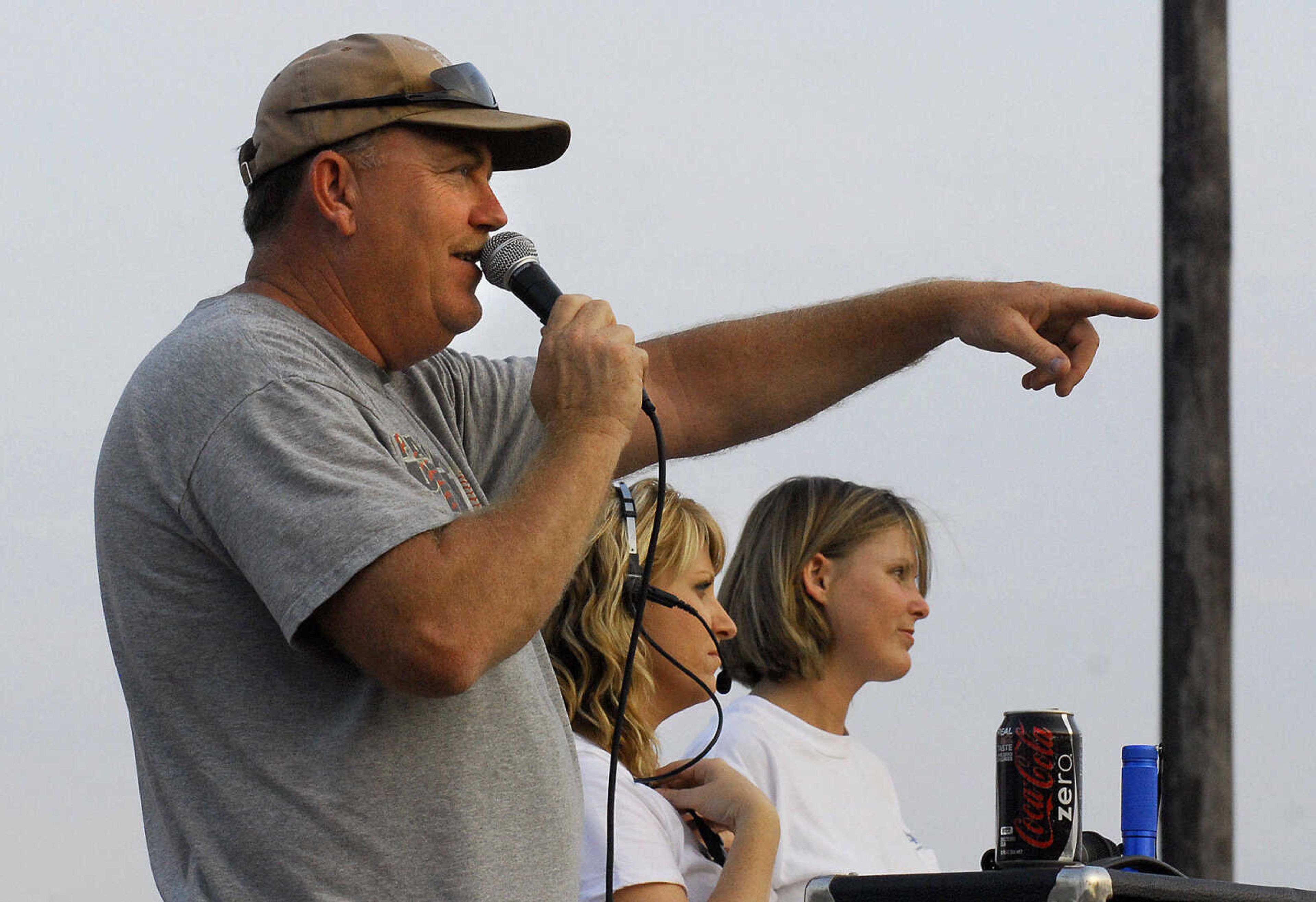 LAURA SIMON~lsimon@semissourian.com
Announcer Kevin Murray, Mendy Ray, center, and Becky Turner keeps their eyes on the competition Saturday, May 29, 2010 during the "Pullin' for St. Jude" tractor and truck pull at Arena Park.