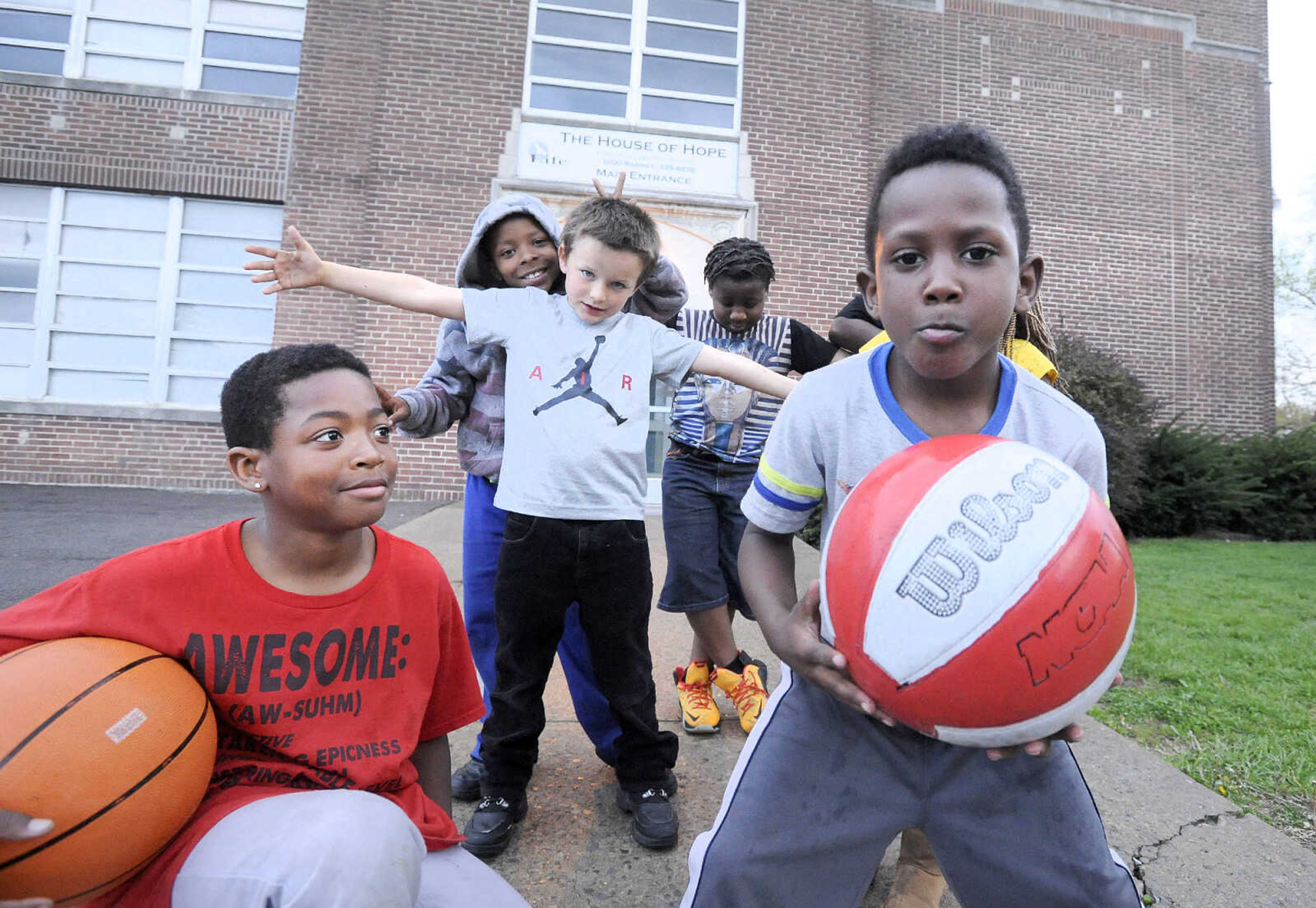 LAURA SIMON ~ lsimon@semissourian.com

Neighborhood children pose for a photo in front of The House of Hope on Thursday evening, April 14, 2016, after participating in a prayer vigil on Locust Street in Cape Girardeau.