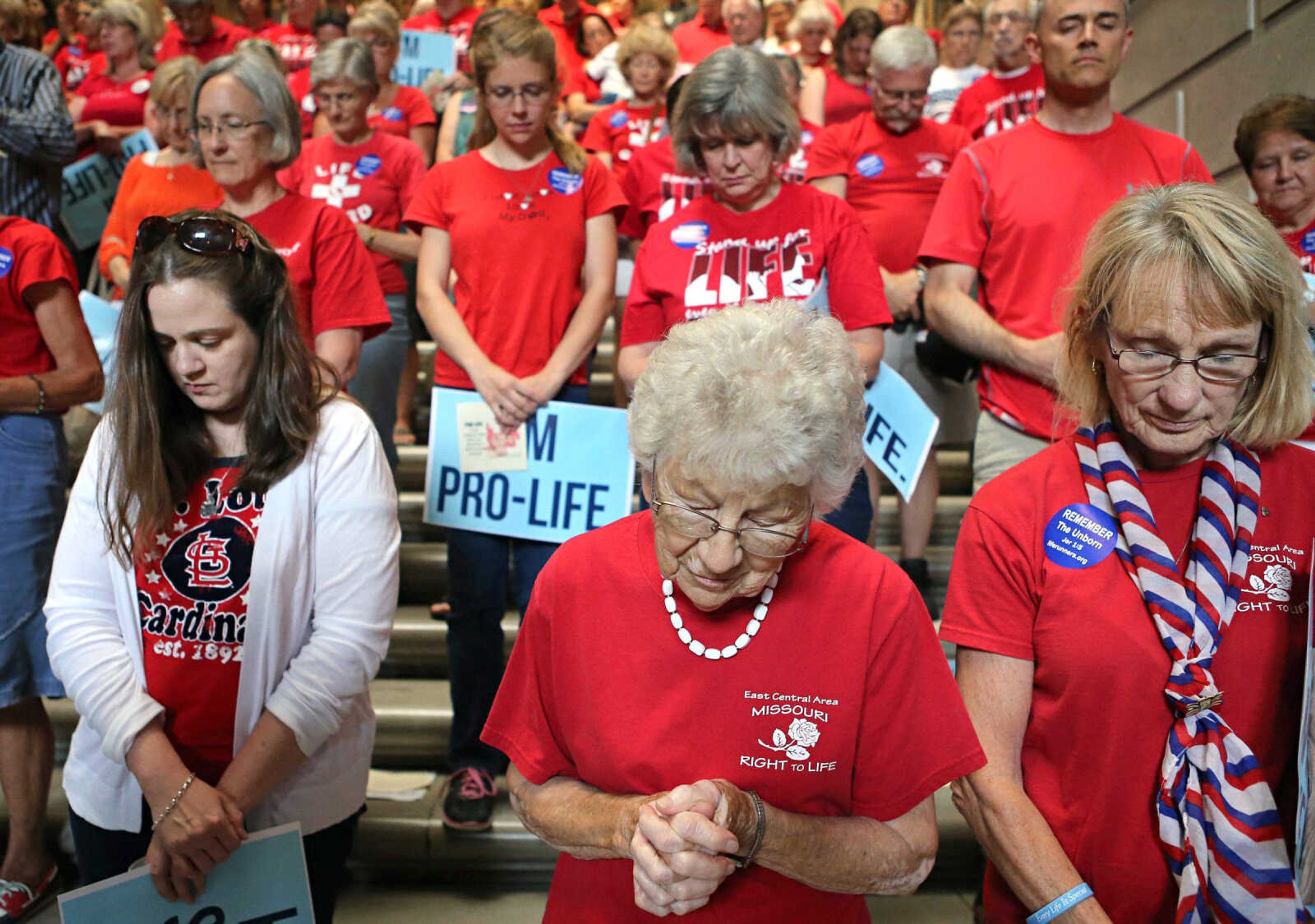 Agnes Piontek, center, 88, of Washington, Missouri, prays during an anti-abortion rally Wednesday in the Statehouse in Jefferson City, Missouri.