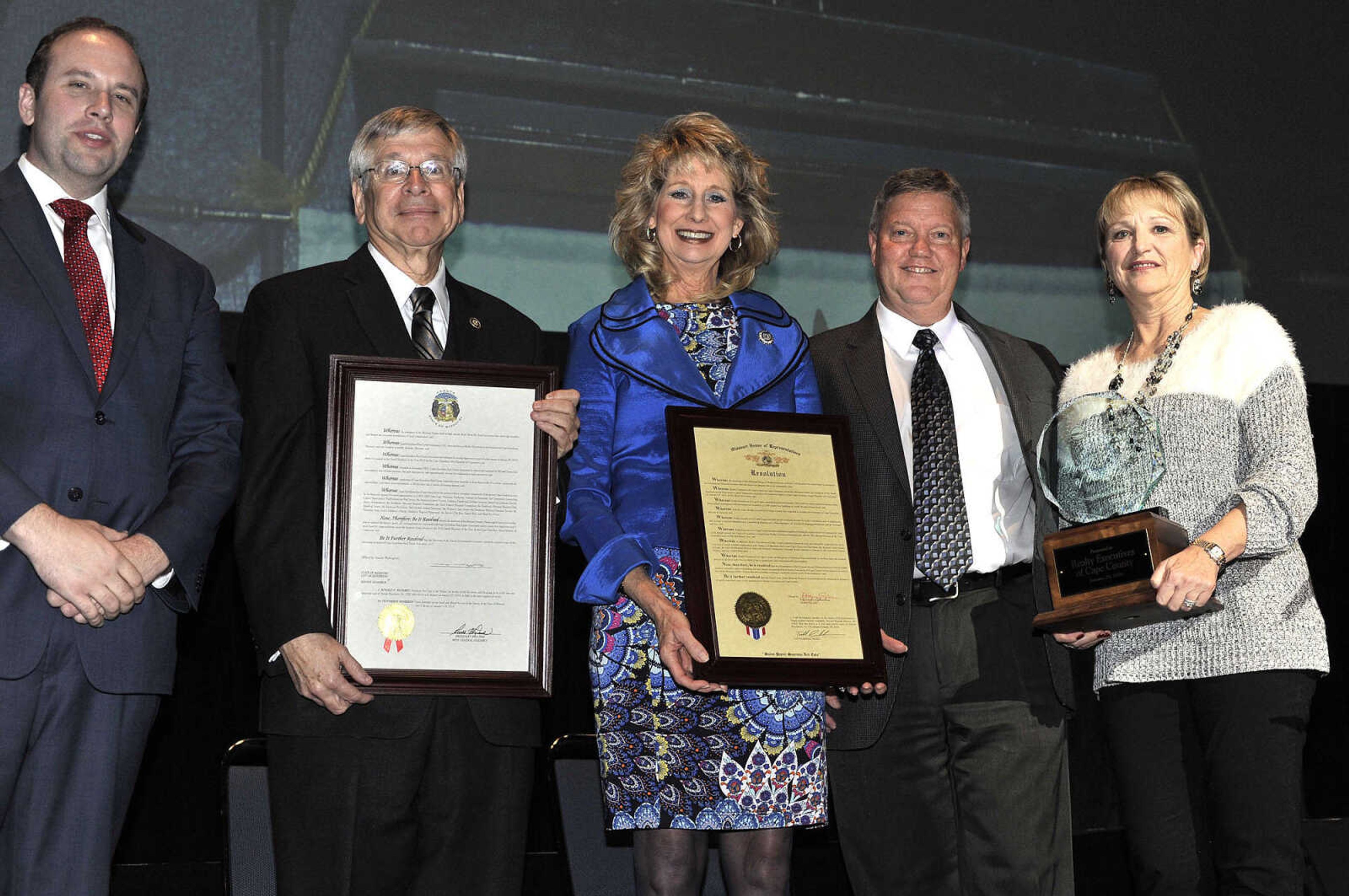 FRED LYNCH ~ flynch@semissourian.com
Bill and Susan Cole, right, owners of Realty Executives of Cape County, receive the Small Business of the Year Award from the Cape Girardeau Area Chamber of Commerce at its annual dinner Friday, Jan. 29, 2016 at the Show Me Center. Also honoring them are U.S. Rep. Jason Smith, left, State Sen. Wayne Wallingford and State Rep. Kathy Swan.