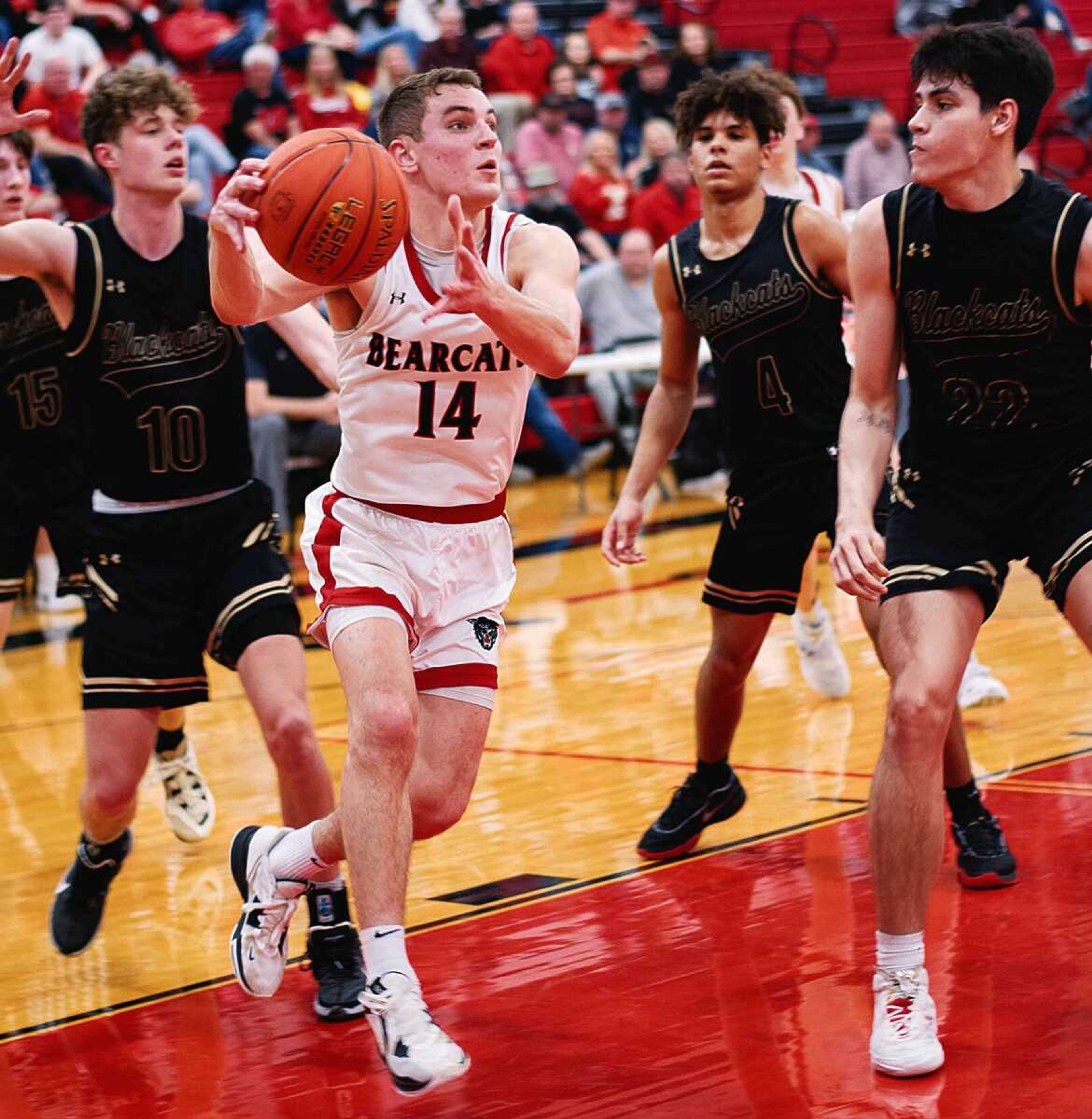 Dexter�s Cole Nichols (14) drives in traffic against Fredericktown during MSHSAA Class 4 District 1 boys basketball semifinal action Wednesday at the Bearcat Event Center in Dexter.