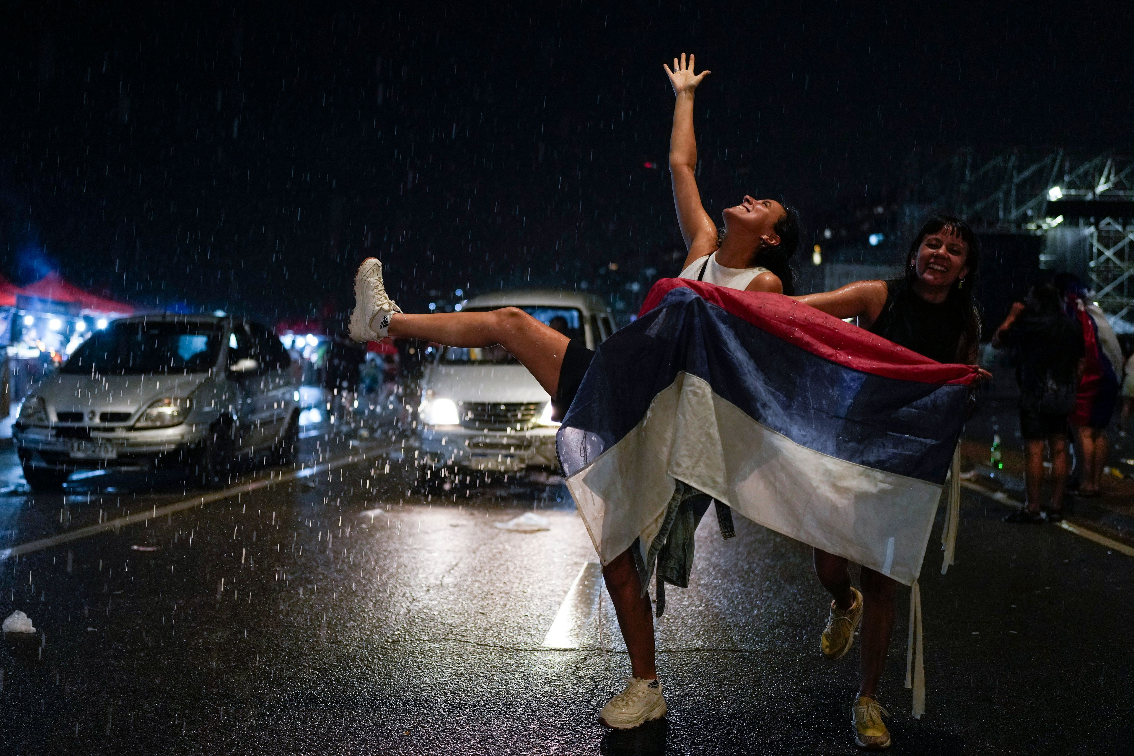 Supporters of the Frente Amplio (Broad Front) celebrate the victory of candidate Yamandú Orsi in the presidential run-off election in Montevideo, Uruguay, Sunday, Nov. 24, 2024. (AP Photo/Natacha Pisarenko)