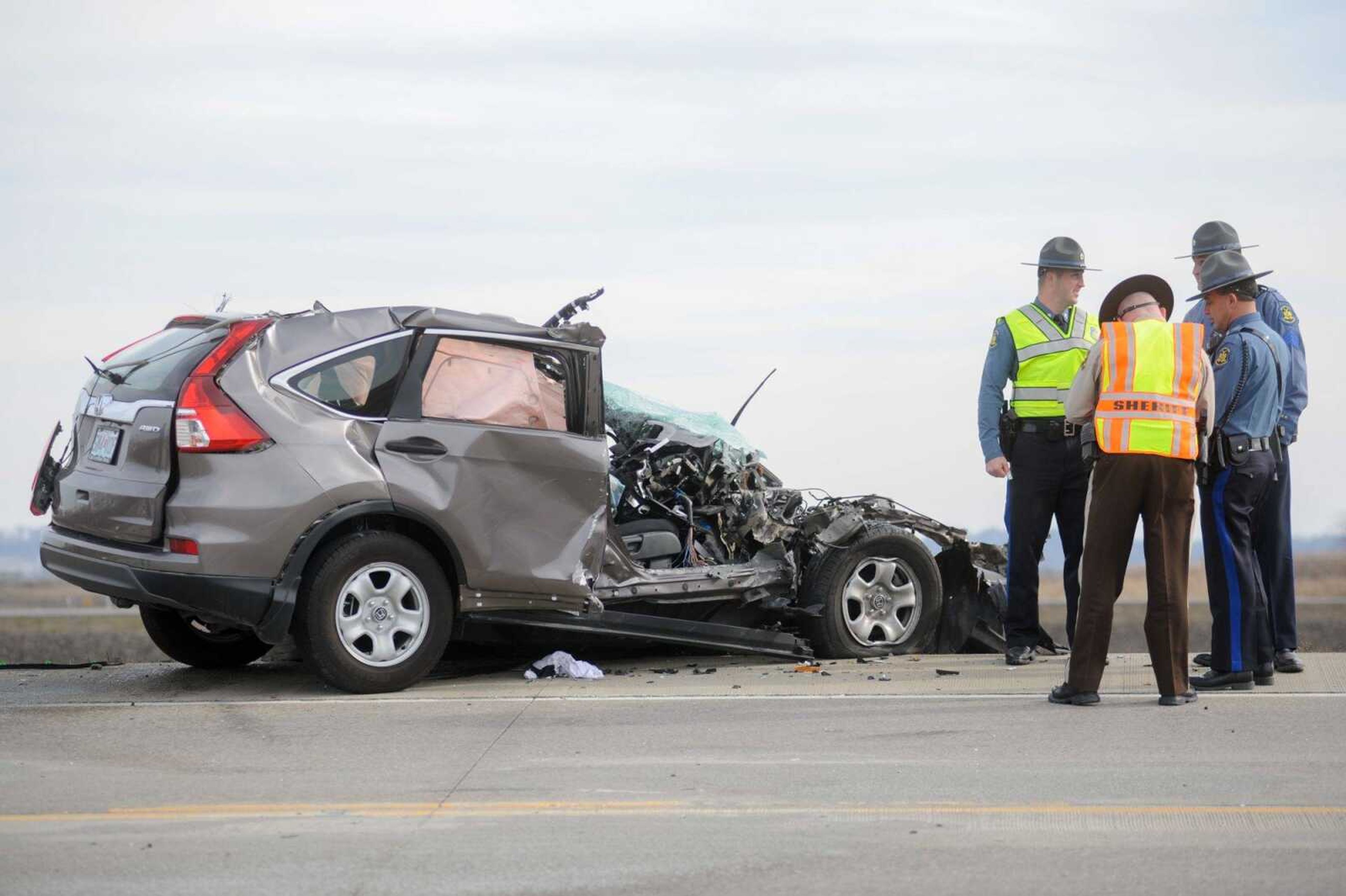 Law enforcement personnel work the scene of an auto accident Thursday. (Glenn Landberg)