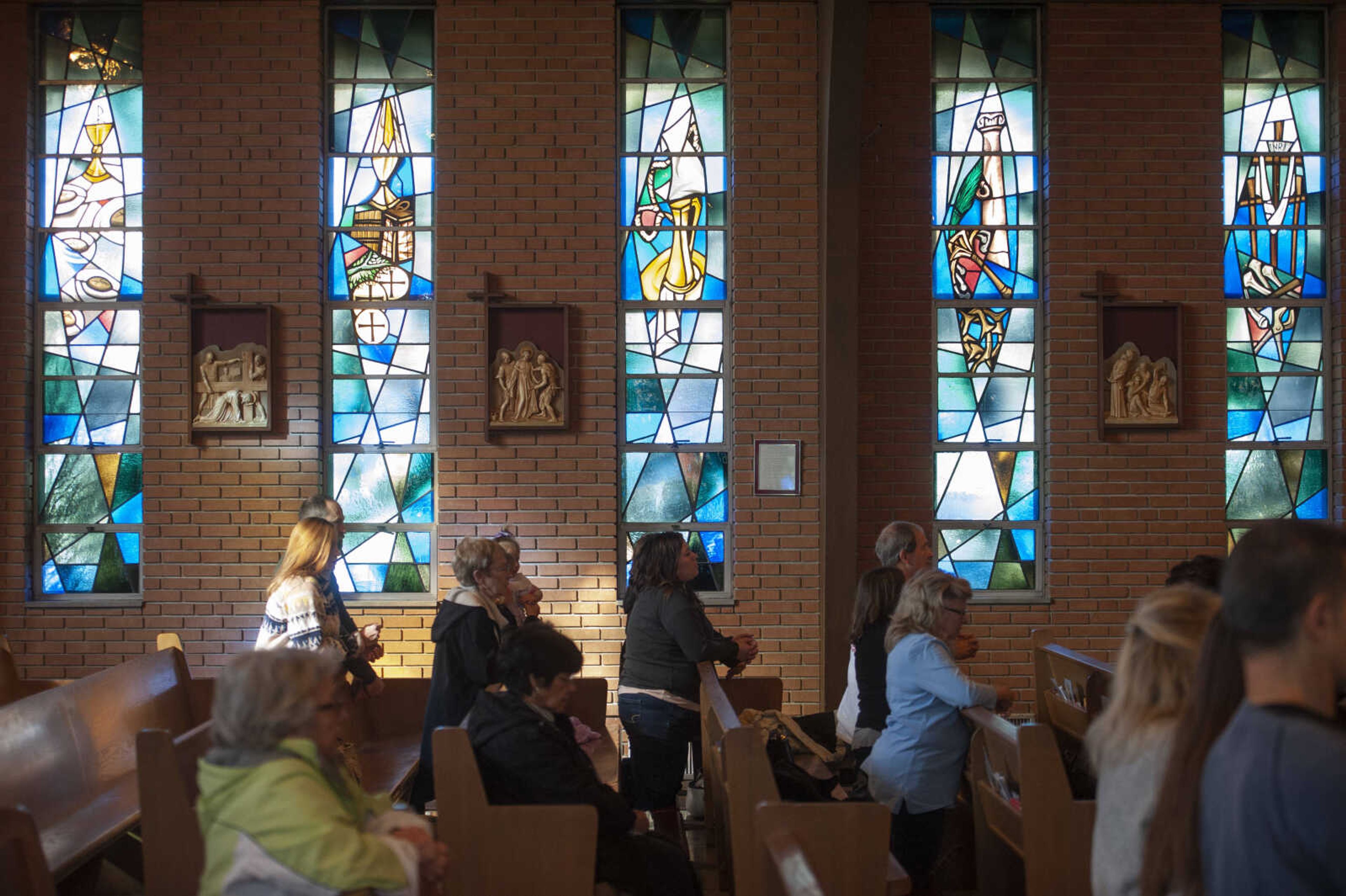 People take part in a group Rosary prayer before the march portion of a March for Life on Saturday, Jan. 18, 2020, at Immaculate Conception Catholic Church in Jackson.