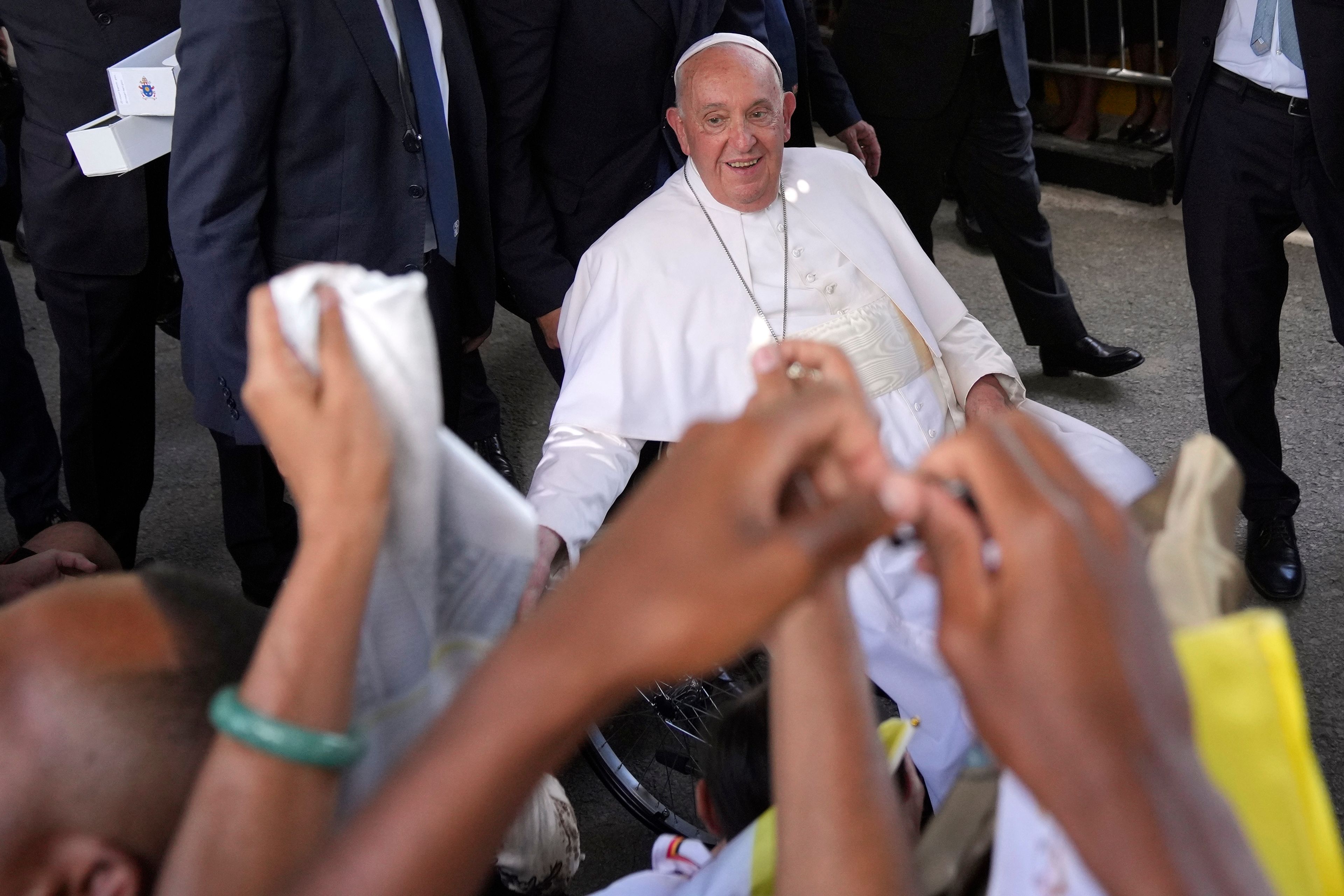 Pope Francis greets the people after the holy mass at the Cathedral of the Immaculate Conception in Dili, East Timor, Tuesday, Sept. 10, 2024. (AP Photo/Dita Alangkara)