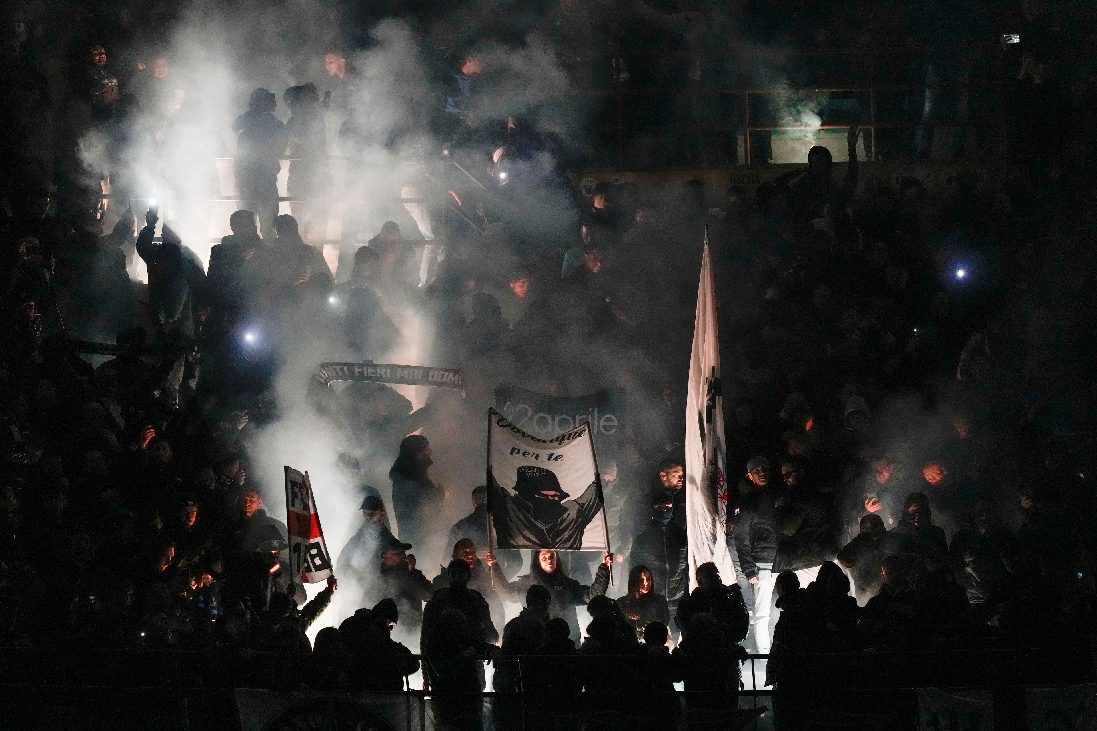 Inter Milan's fans cheer for their team prior to a Serie A soccer match between Inter Milan and Napoli at the San Siro stadium in Milan, Italy, Sunday, Nov. 10, 2024. (AP Photo/Luca Bruno)