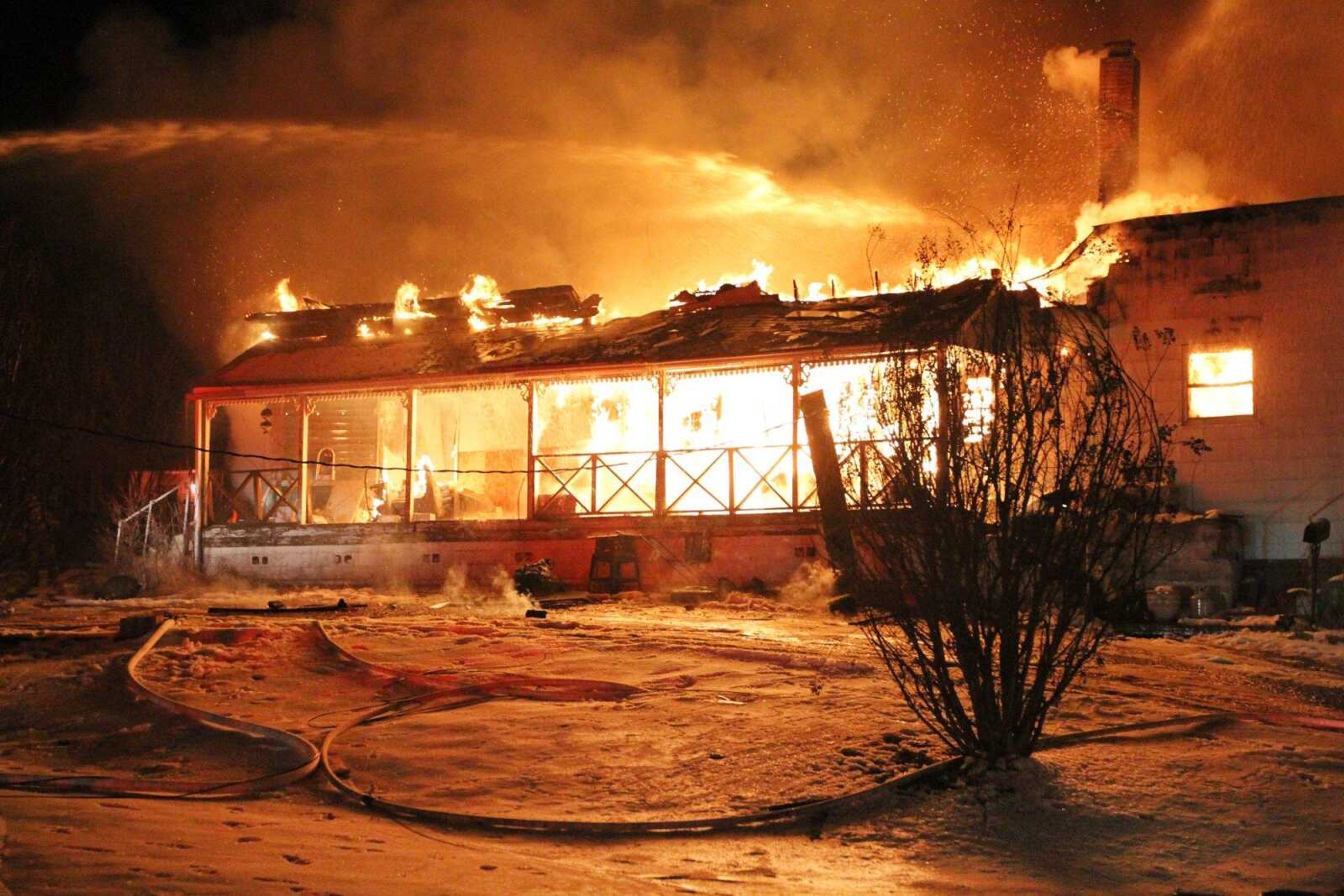 Members from the Fruitland and Jackson fire departments battle a blaze that broke out in a home at 649 Jackson Road in Pocahontas on Friday night. There were no injuries. (Glenn Landberg)