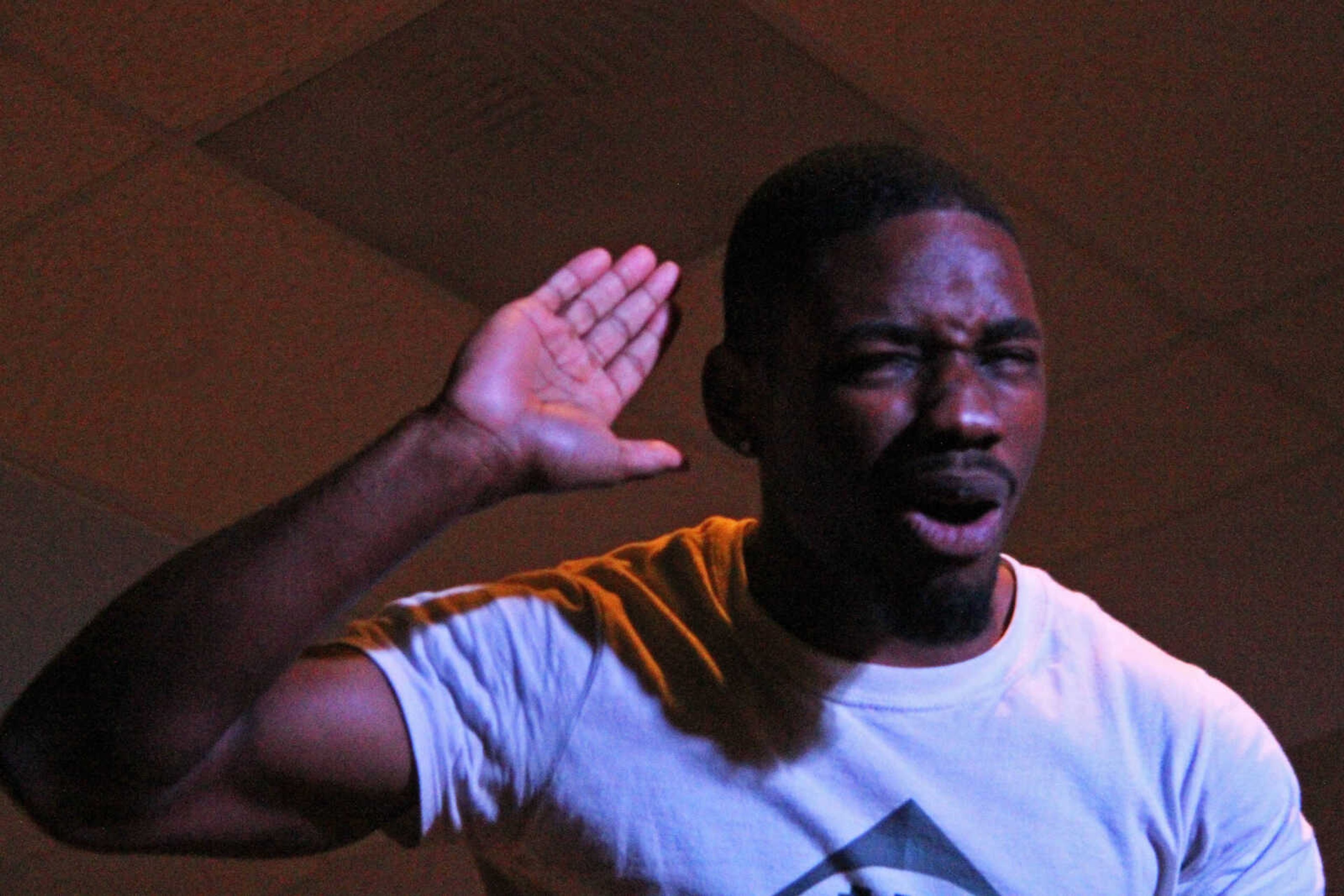 Jimmie Miller energizes the crowd with a motivational chant, which he does often at Broken and Redeemed Dance Studio.