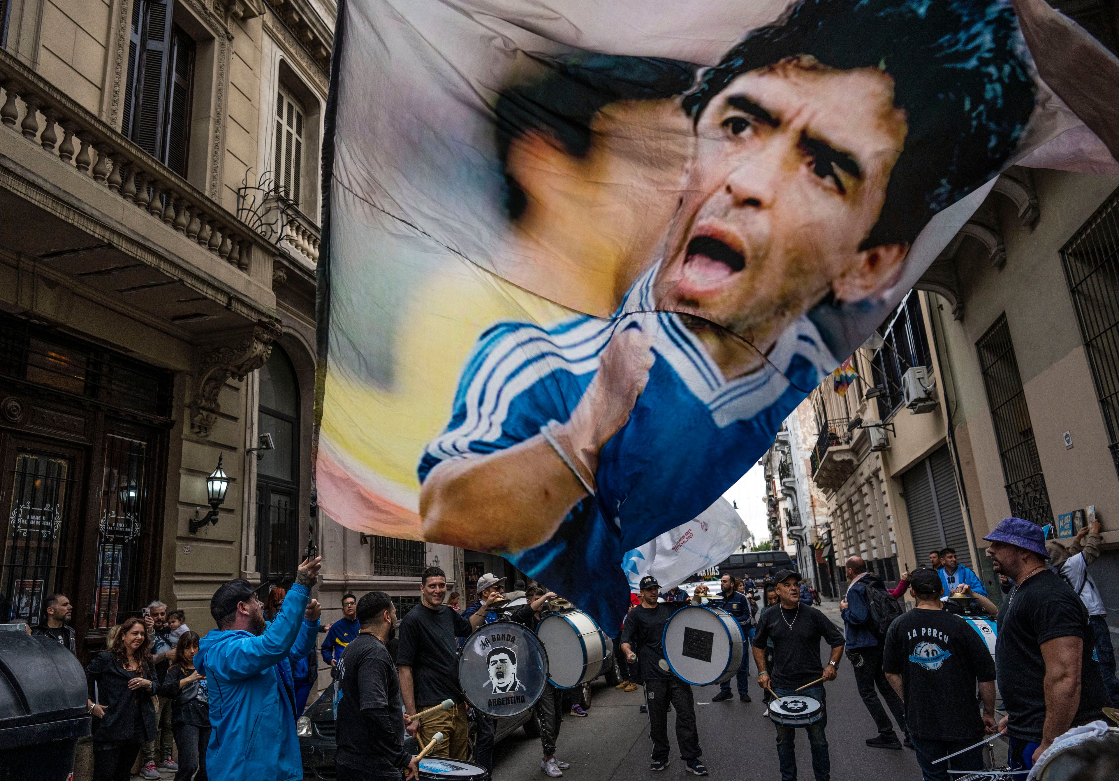 FILE - Fans gather to celebrate the anniversary of the "Hand of God" goal and the "Goal of the Century" scored by soccer legend Diego Maradona against England during the 1986 World Cup quarterfinals, in Buenos Aires, Argentina, June 22, 2024. (AP Photo/Rodrigo Abd, File)