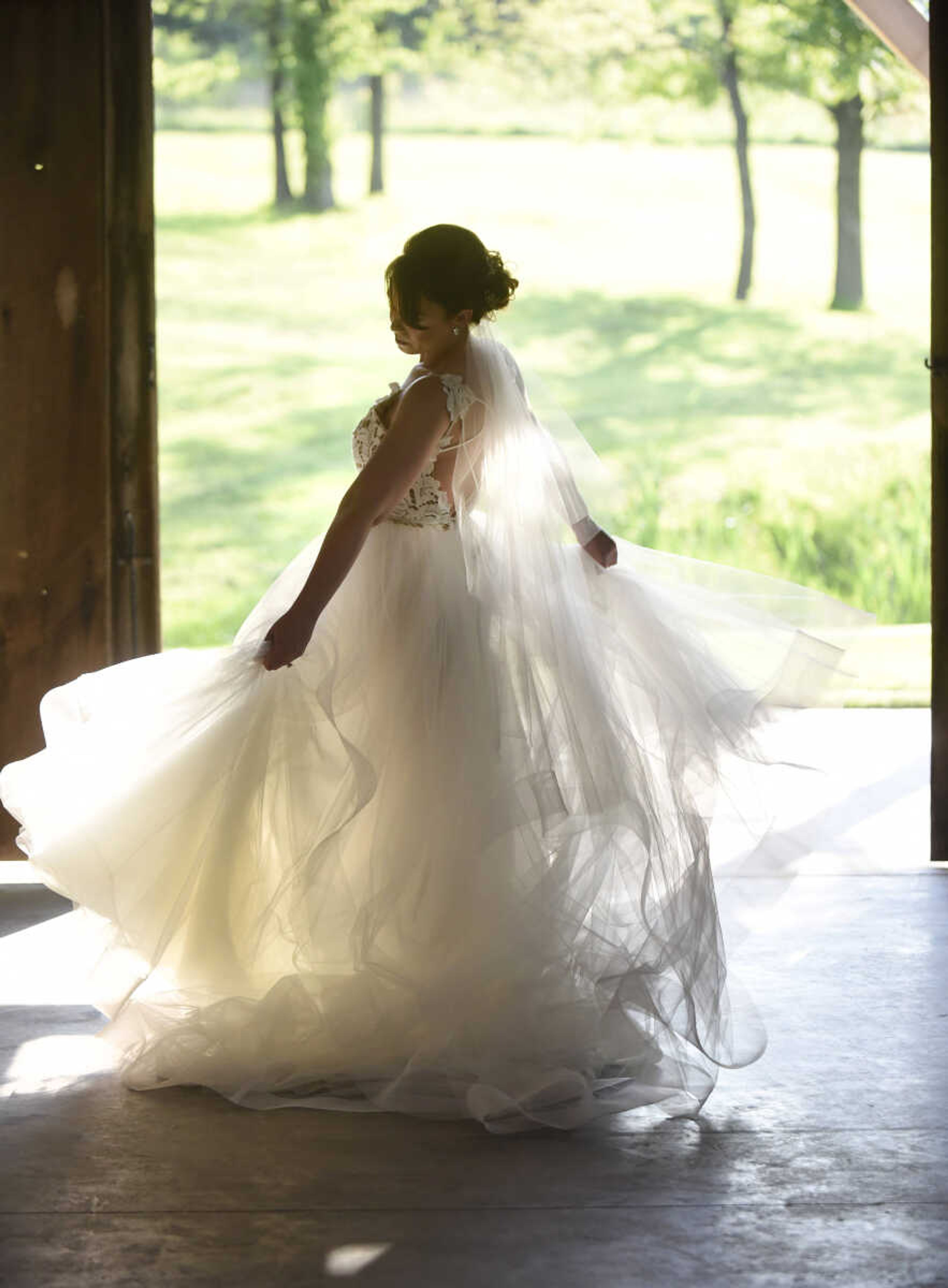 Blush by Hayley Paige: Style 1700 "Halo" 
Ivory lace and tulle bridal ball gown, scalloped V-neck bodice with low open back and strap detail, tiered tulle skirt with horsehair trim. Available at Magnolias Bridal Boutique in Cape Girardeau.