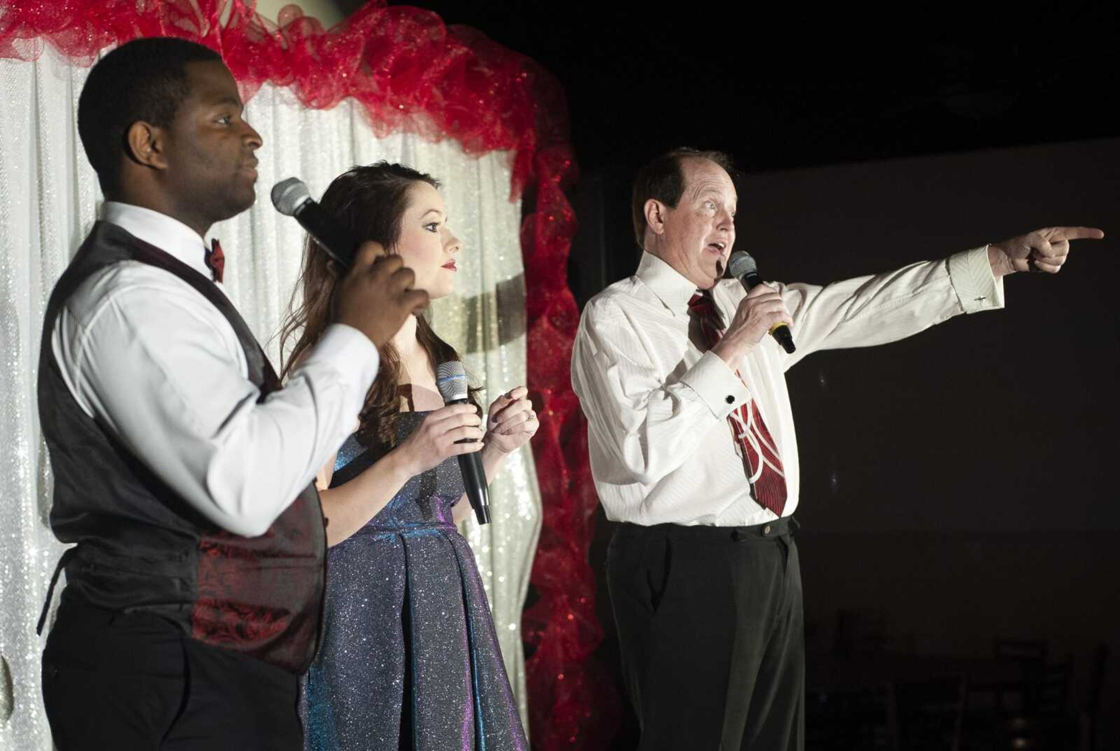 From left, Brodrick Twiggs, Mary Niswonger and Mike Dumey rehearse for "HITS!!" dinner showcase Friday at Shriner's Hall in Jackson.