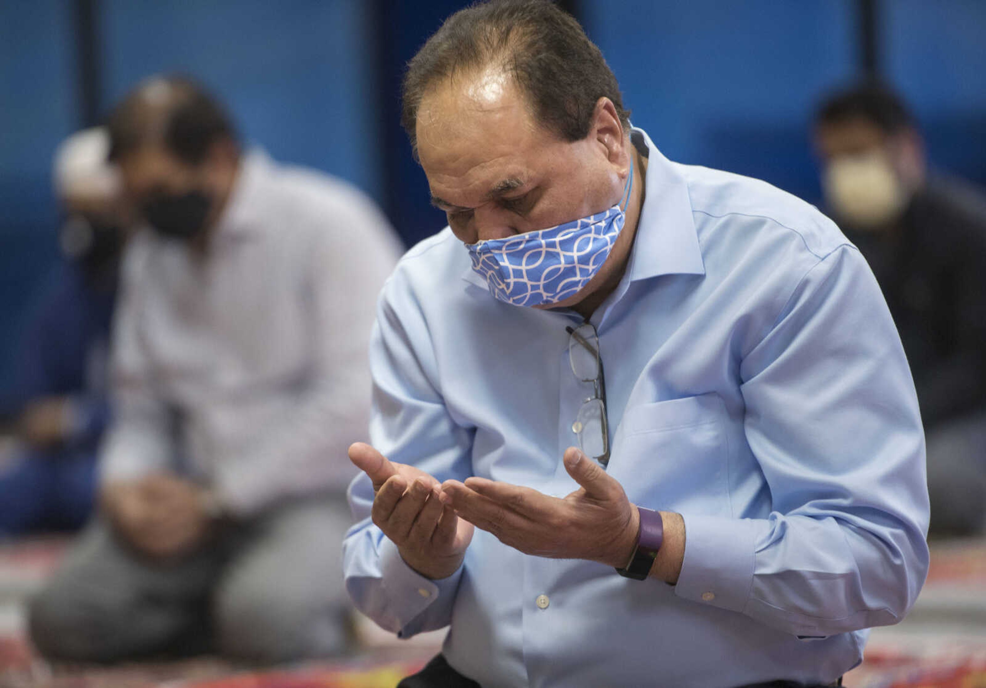 Shafiq Malik spreads his hands during prayer Friday, May 8, 2020, in Cape Girardeau.