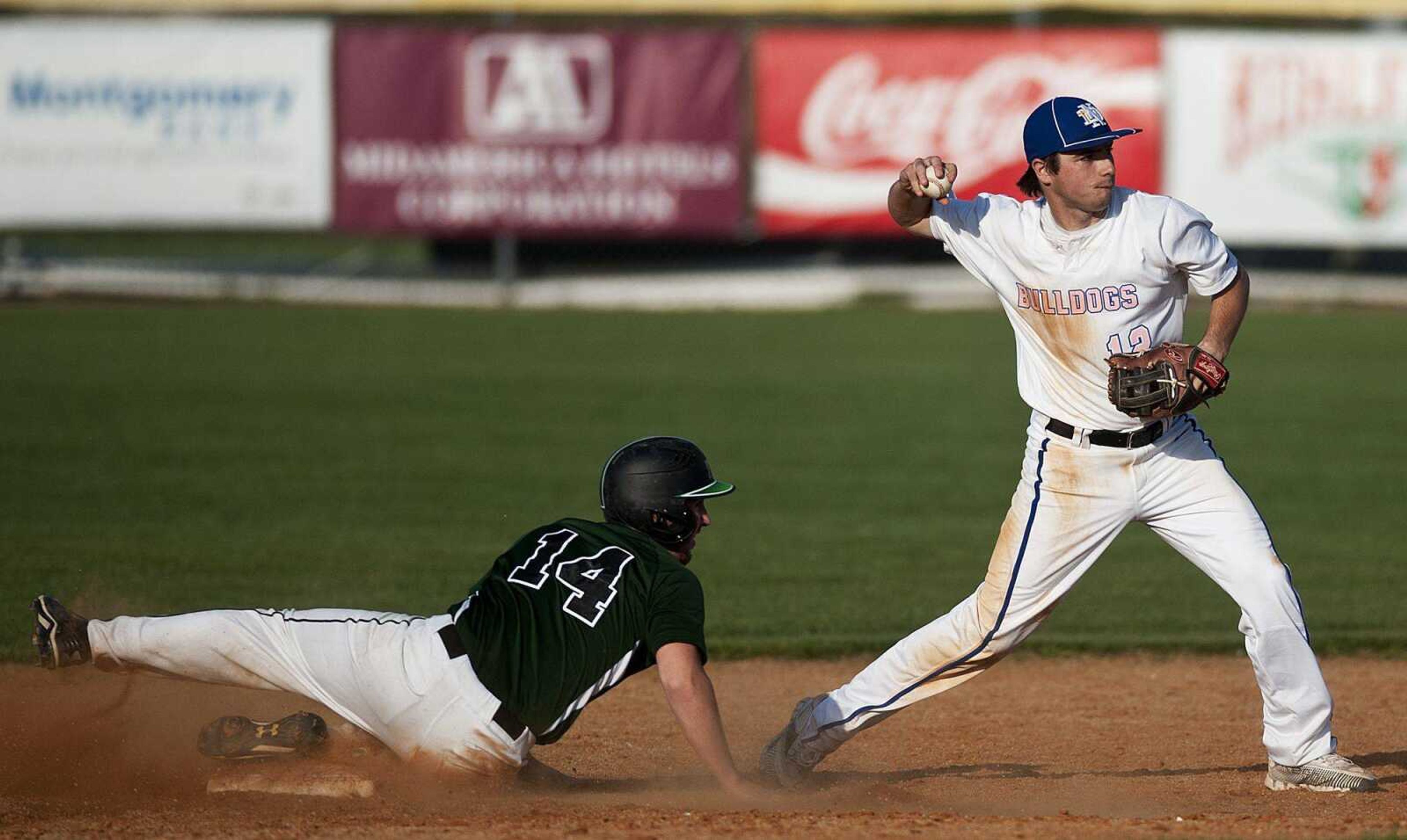 Notre Dame shortstop Griffin Siebert throws to first baseman after getting the force out on Perryville shortstop Garrett Martin in the sixth inning of the Bulldogs' 11-1 six-inning win over the Pirates Wednesday, April 23, at Notre Dame Regional High School. (Adam Vogler)