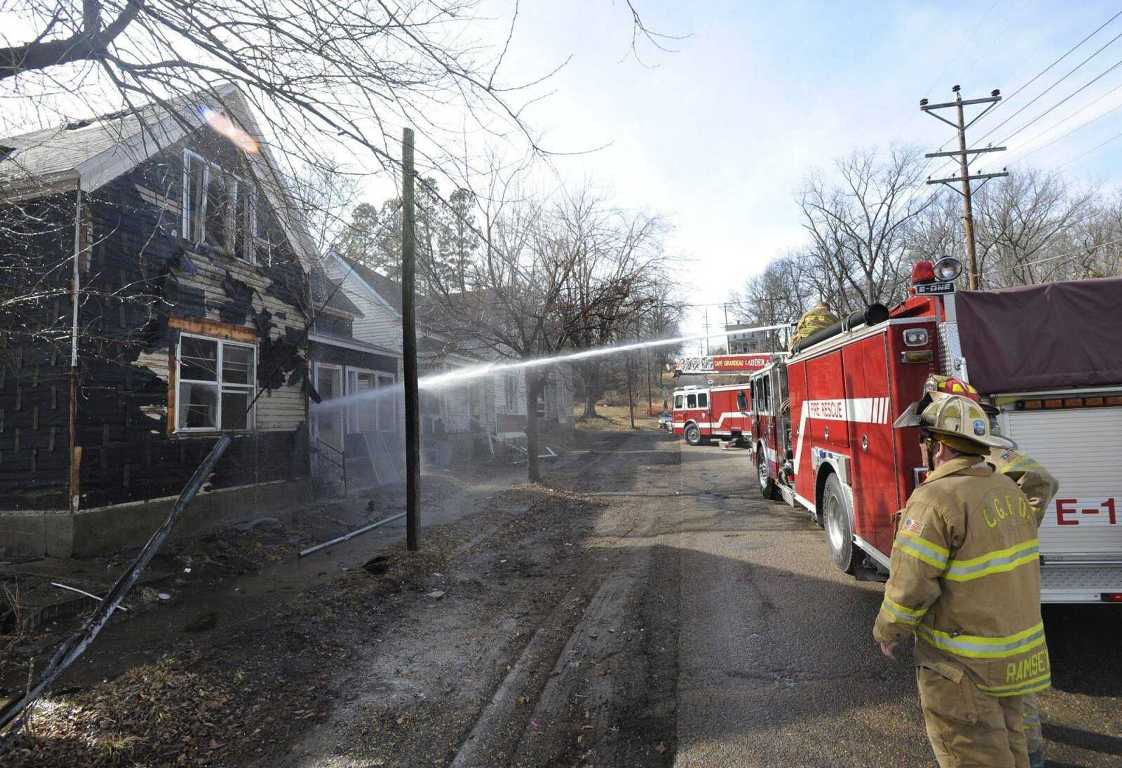 Cape Girardeau firefighters practice training techniques Tuesday using the houses that will be demolished soon in the vicinity of the new casino. (Fred Lynch)