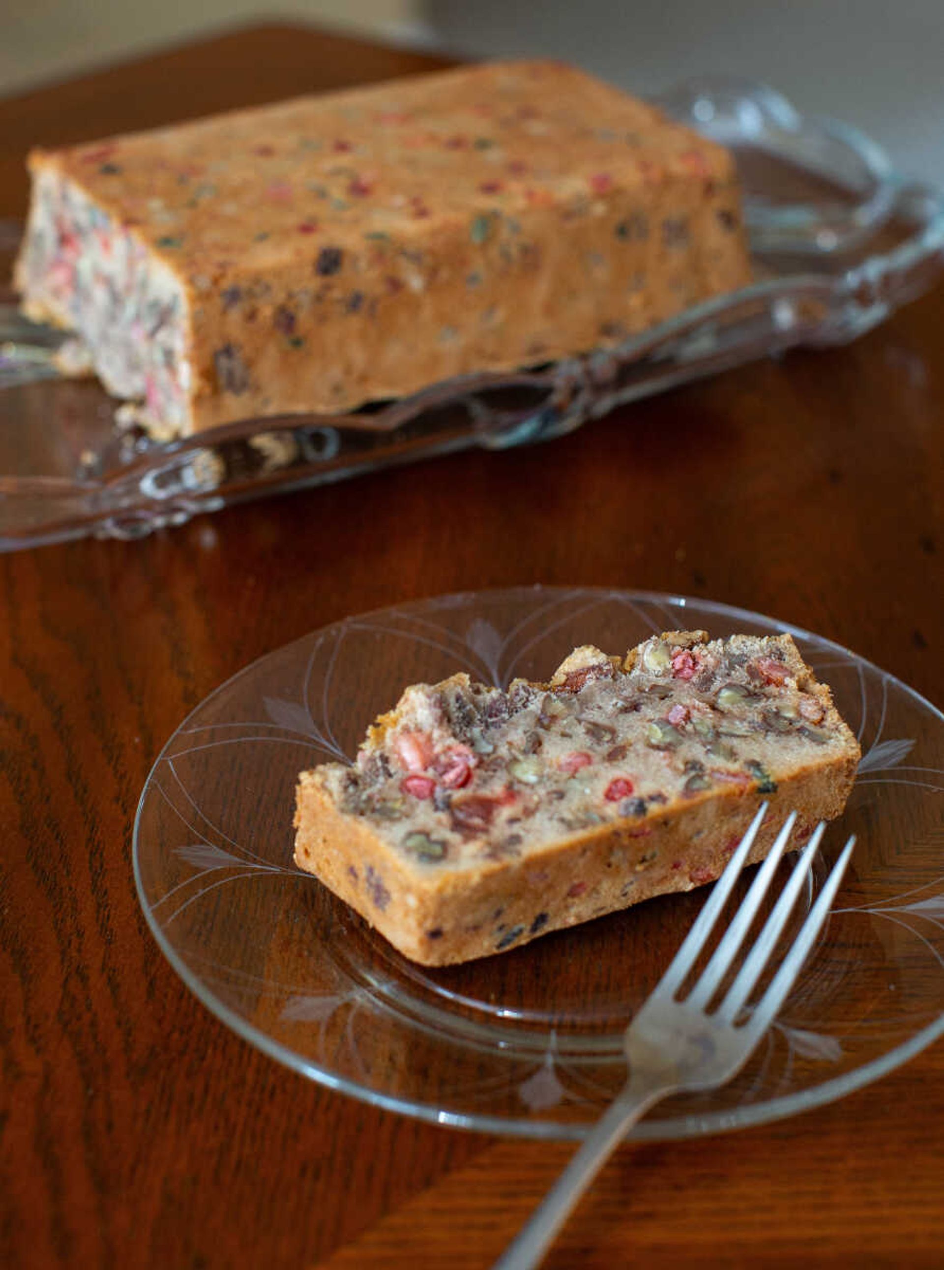 One slice of fruitcake waits to be eaten on Sue Jones's dining room table. Jones makes fruitcake for Christmas, adjusting a recipe she found in an old dessert cookbook.