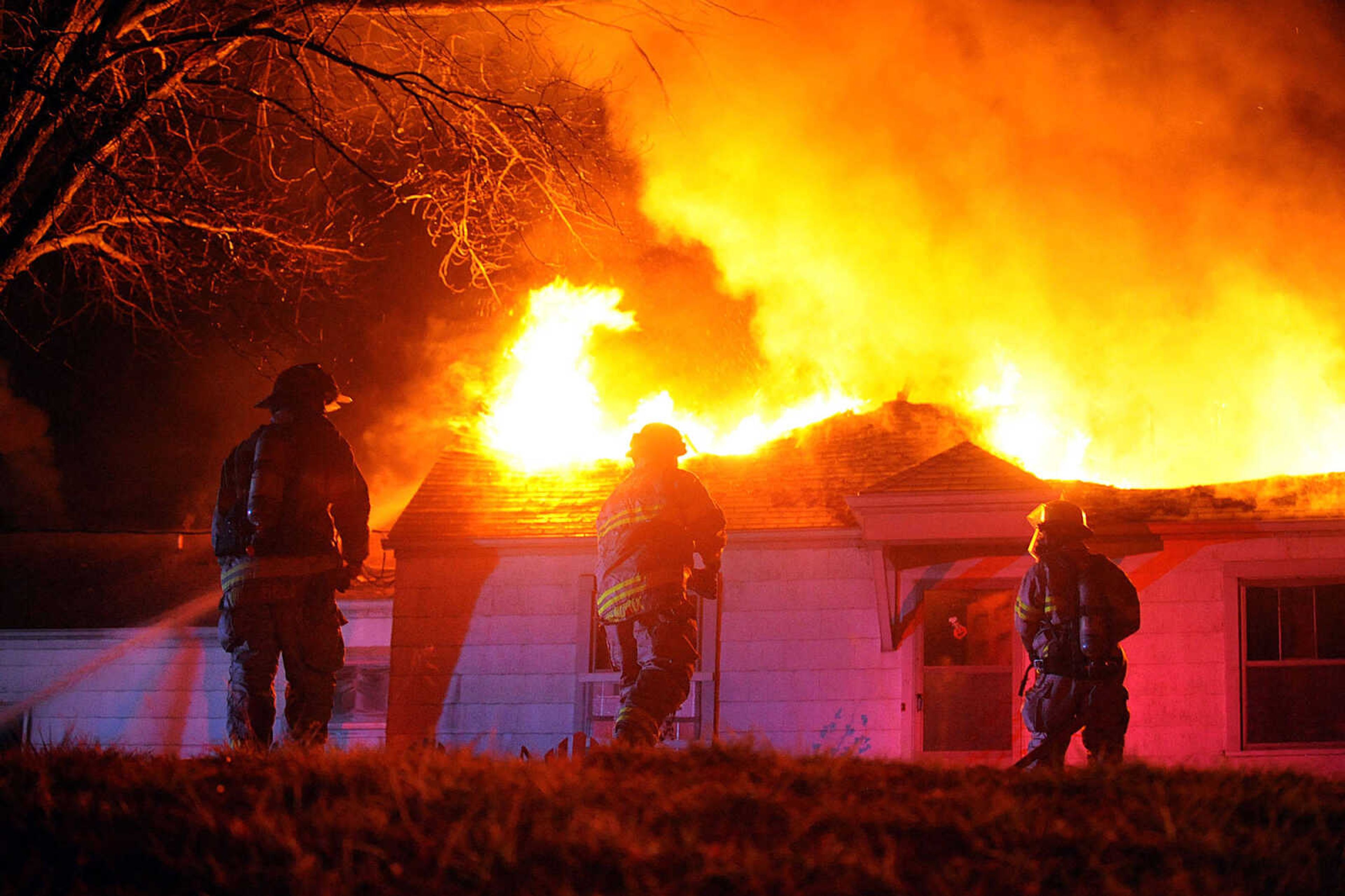 LAURA SIMON ~ lsimon@semissourian.com
Firefighters from Delta, Gordonville, Cape Girardeau, Millersville, Fruitland and East County Fire Departments battle a structure fire Wednesday night, January 9, 2012 on Onyx Lane in Cape Girardeau.