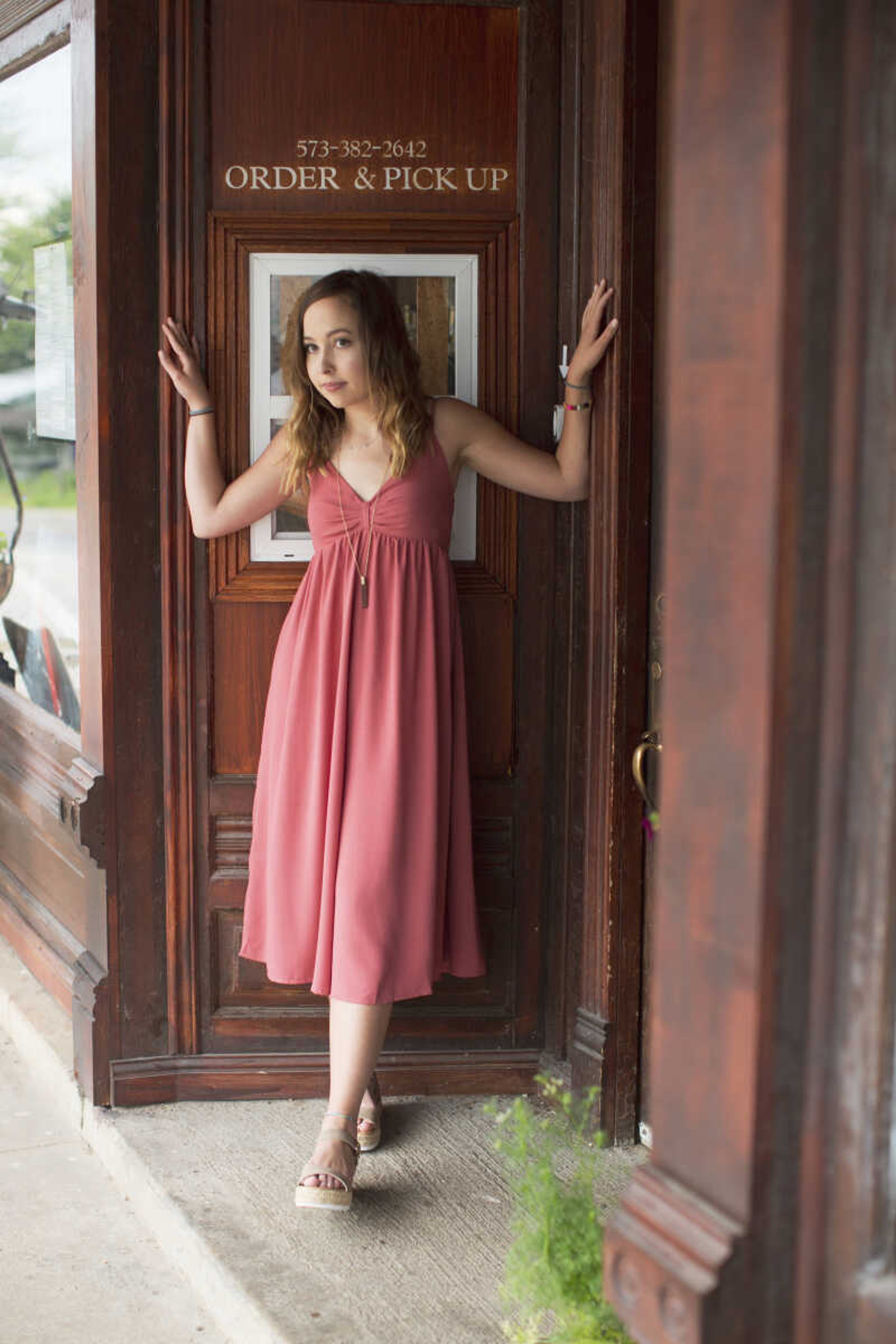 Emily Sachs models clothes, shoes and jewelry from Jenny May Boutique in Cape Girardeau.