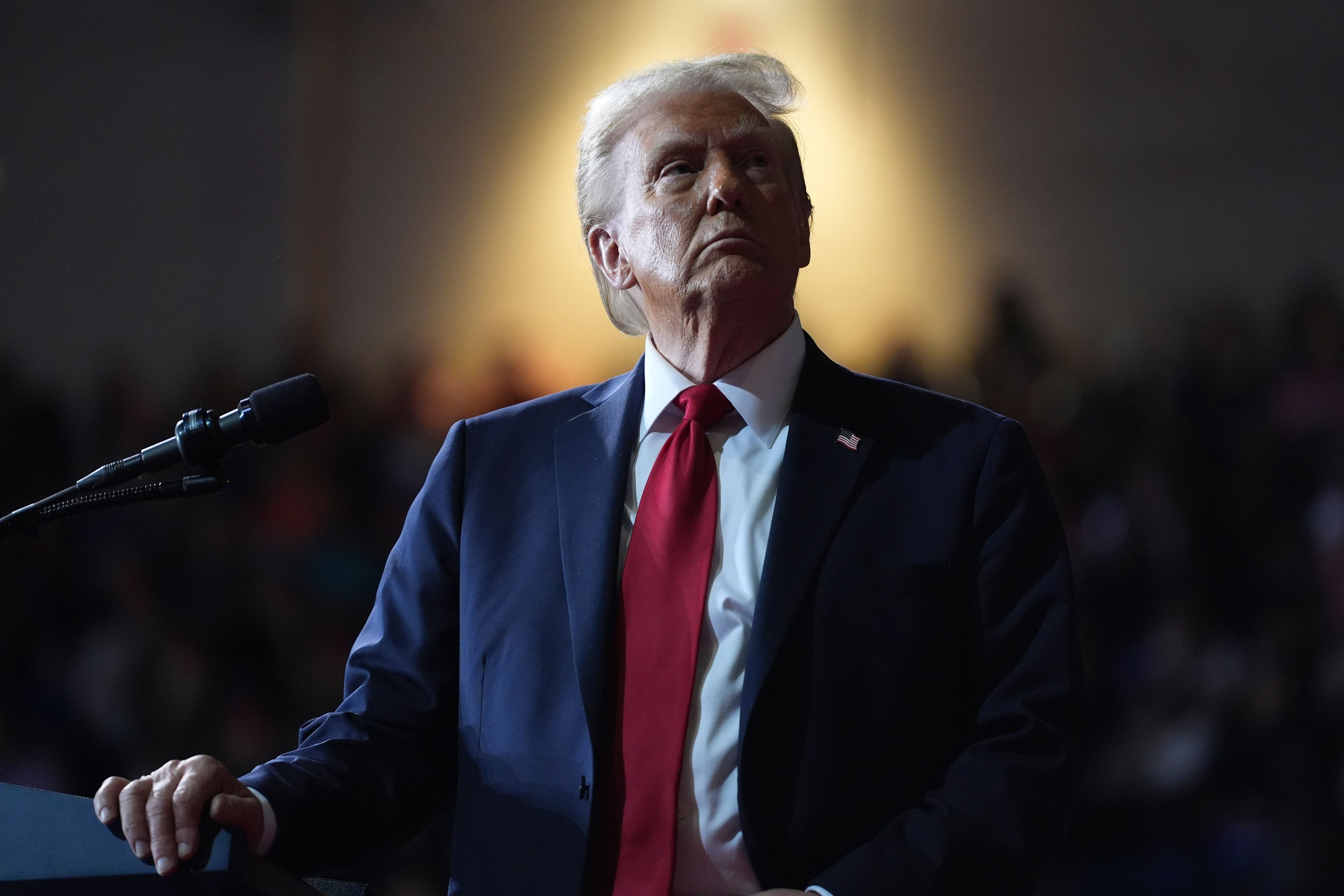 Republican presidential nominee former President Donald Trump watches a video screen at a campaign rally at the Salem Civic Center, Saturday, Nov. 2, 2024, in Salem, Va. (AP Photo/Evan Vucci)